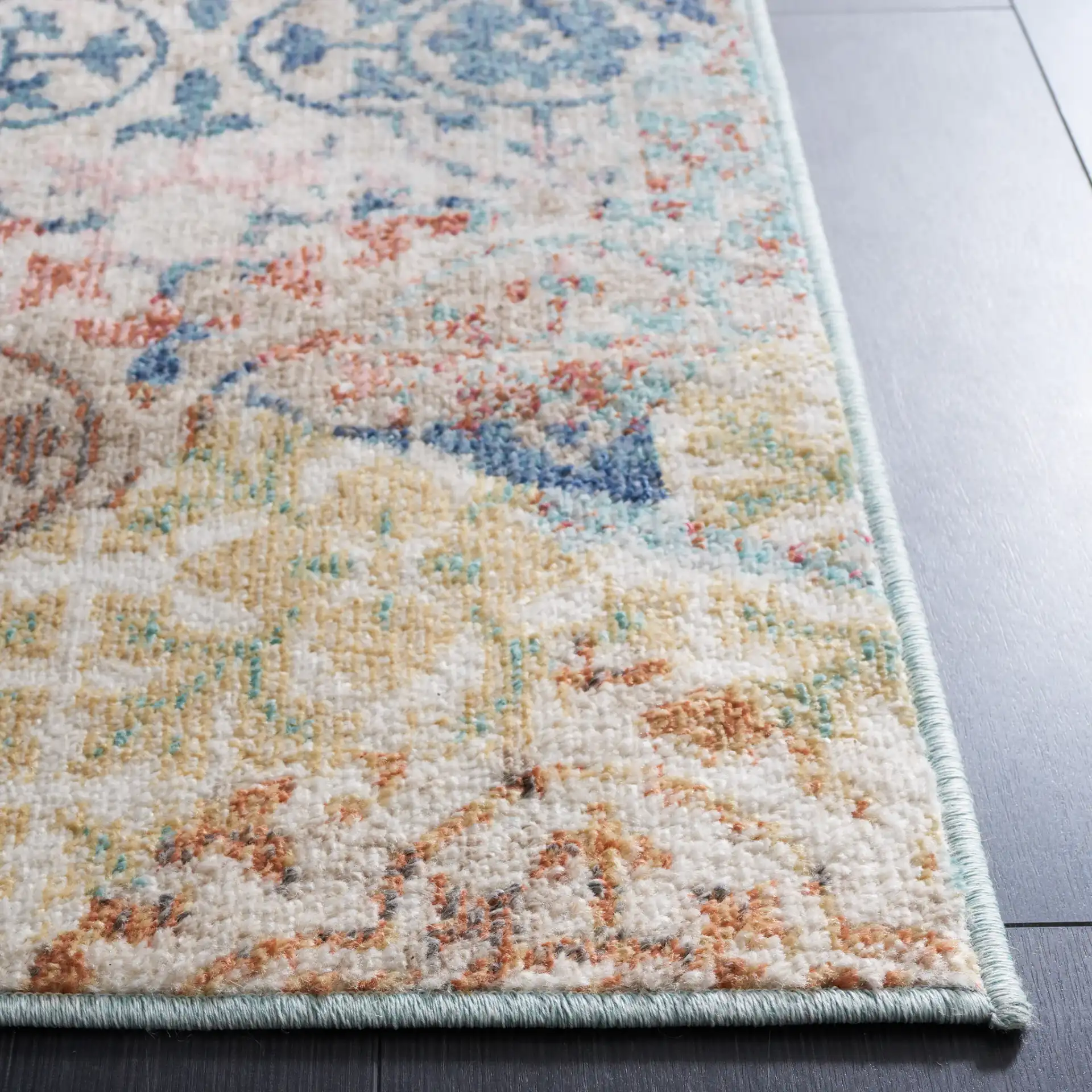 Phoenix Distressed Patchwork Rug in Blue / Rust in a styled room