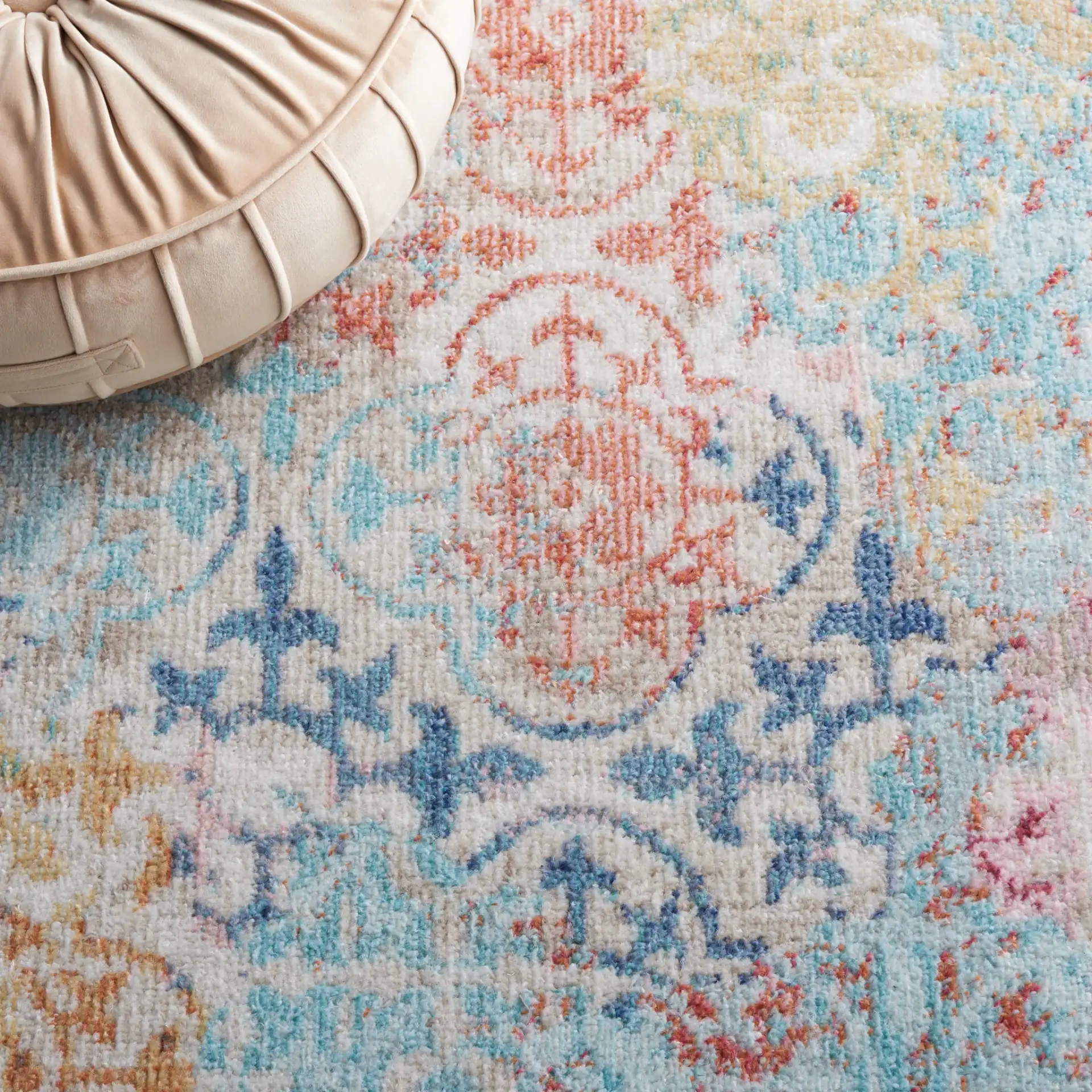 Phoenix Distressed Patchwork Rug in Blue / Rust in a styled room