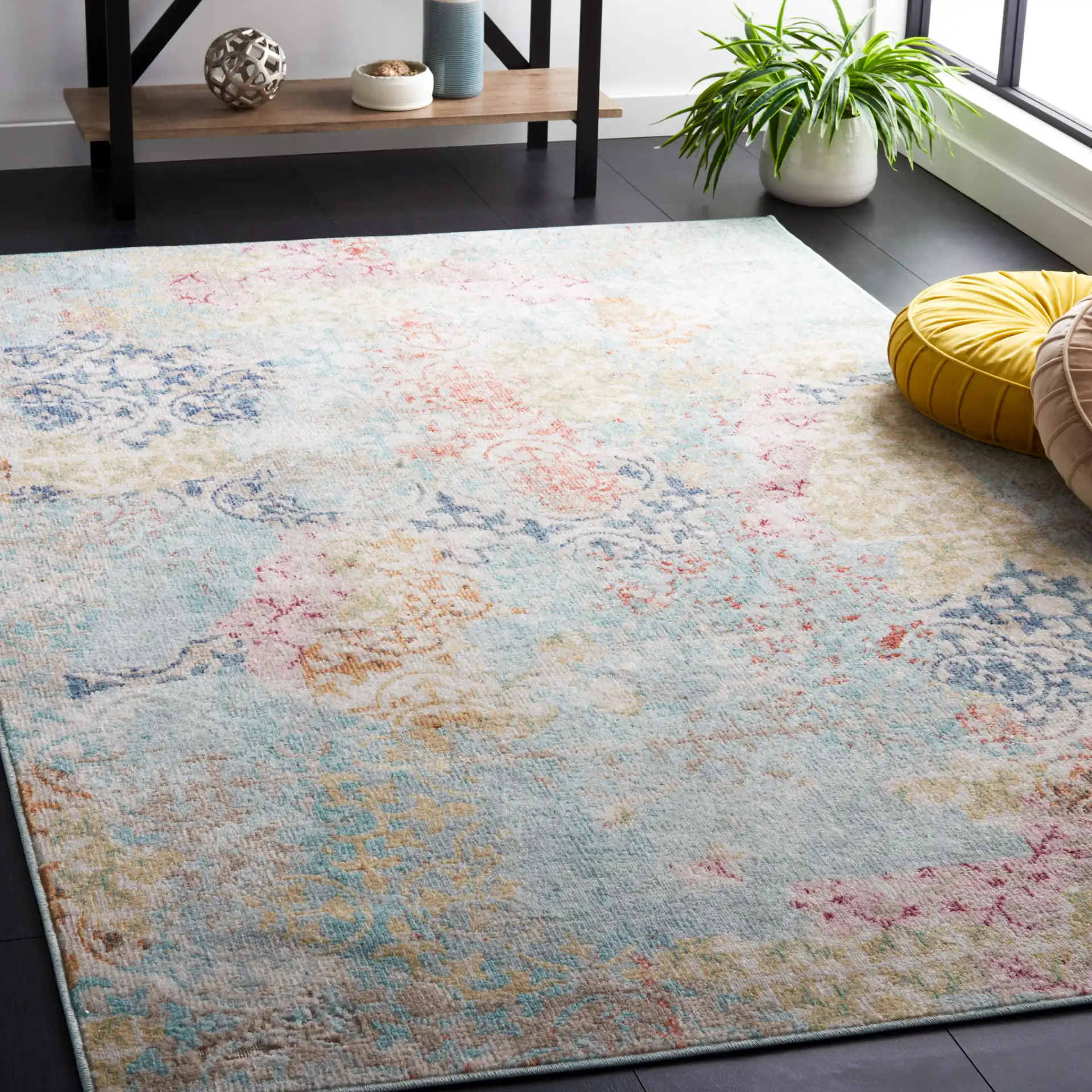 Phoenix Distressed Patchwork Rug in Blue / Rust in a styled room