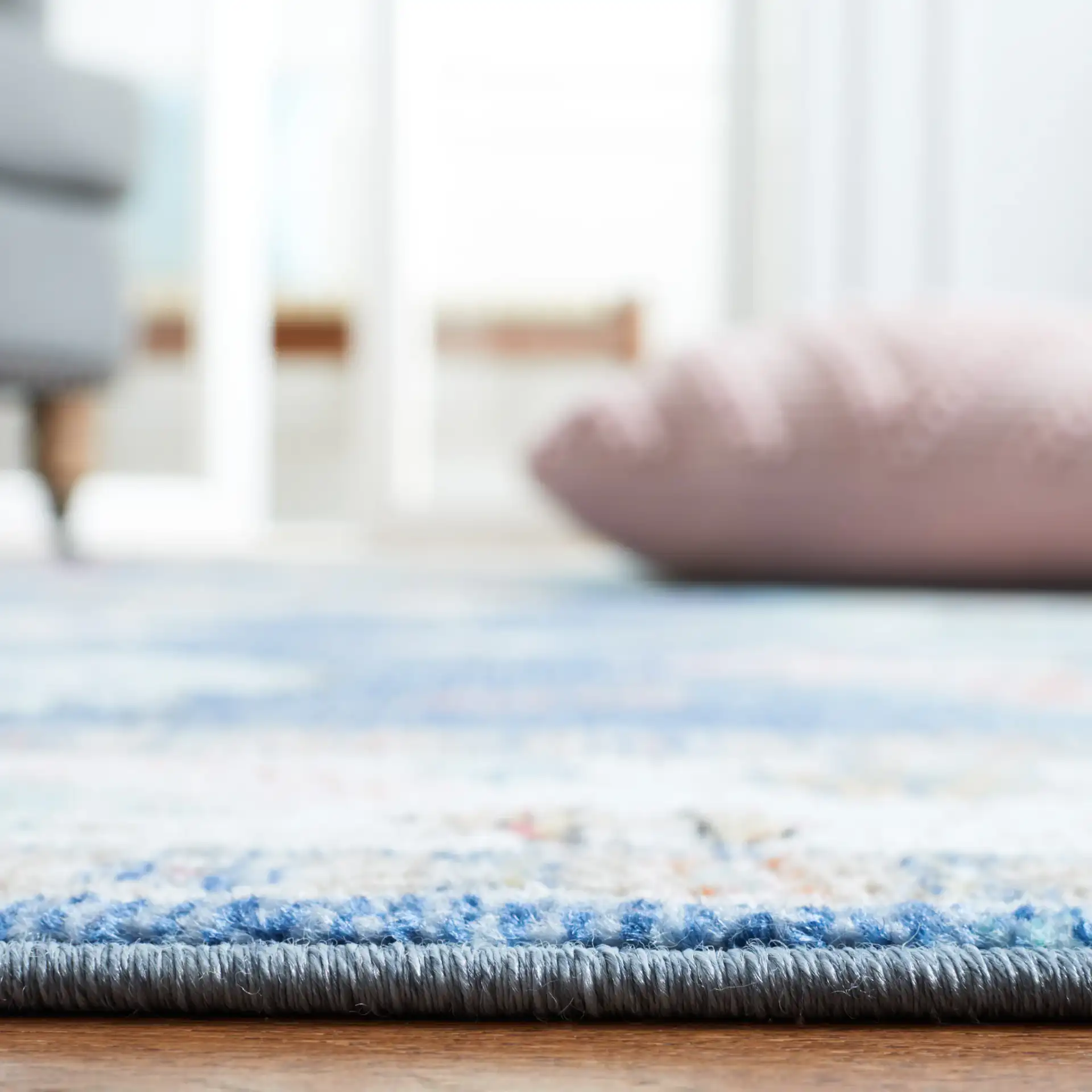 Phoenix Floral Bordered Rug in Navy / Ivory in a styled room