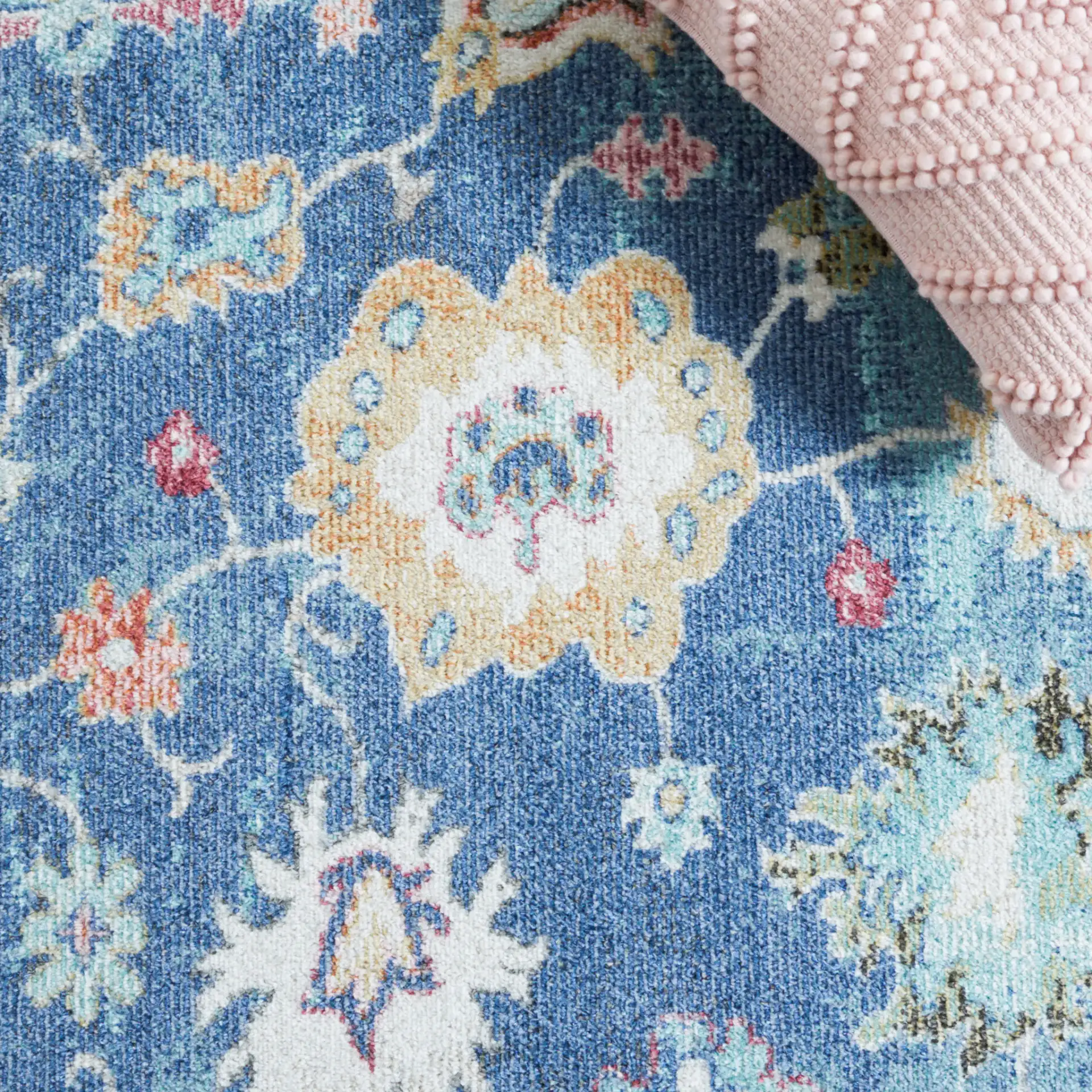 Phoenix Floral Bordered Rug in Navy / Ivory in a styled room