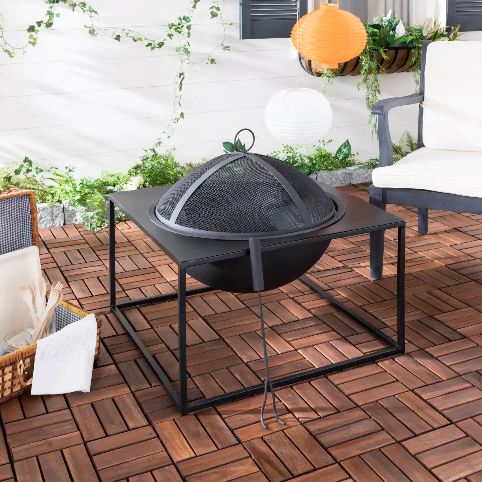 Leros Square Fire Pit in Black in a styled room