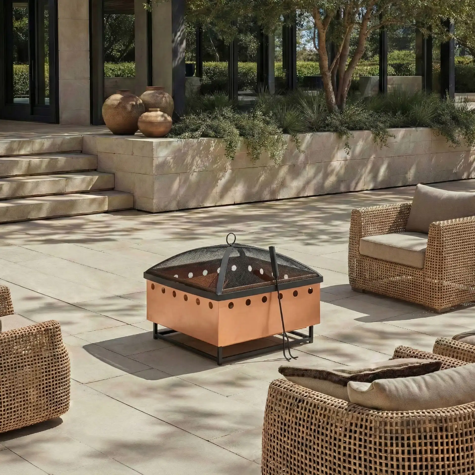 Wyatt Square Fire Pit in Copper / Black in a styled room