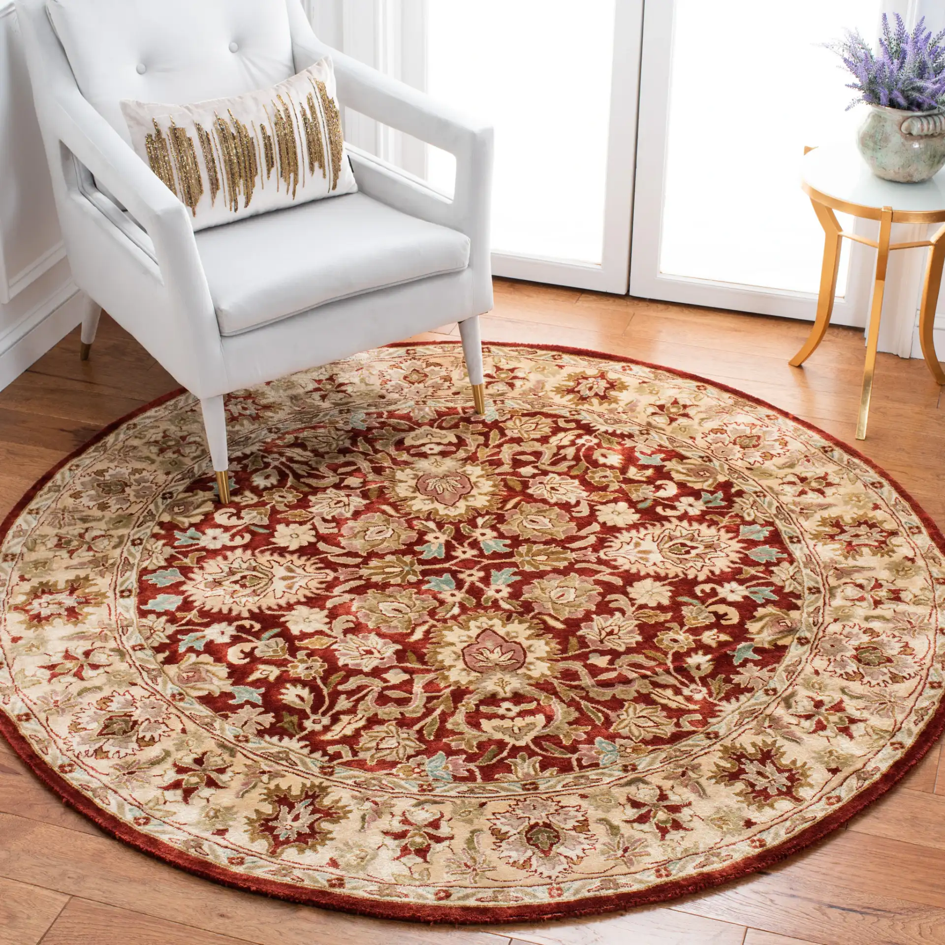 Persian Legend Floral Bordered Oval Wool Rug in Rust in a styled room