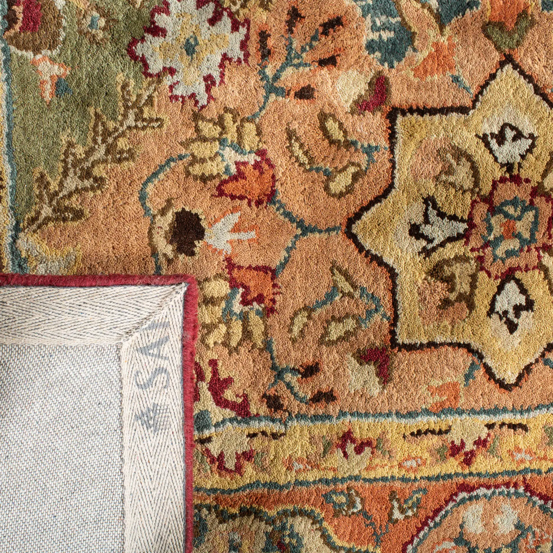 Persian Legend Floral Tile Hand-Tufted Wool Rug in Red / Rust in a styled room
