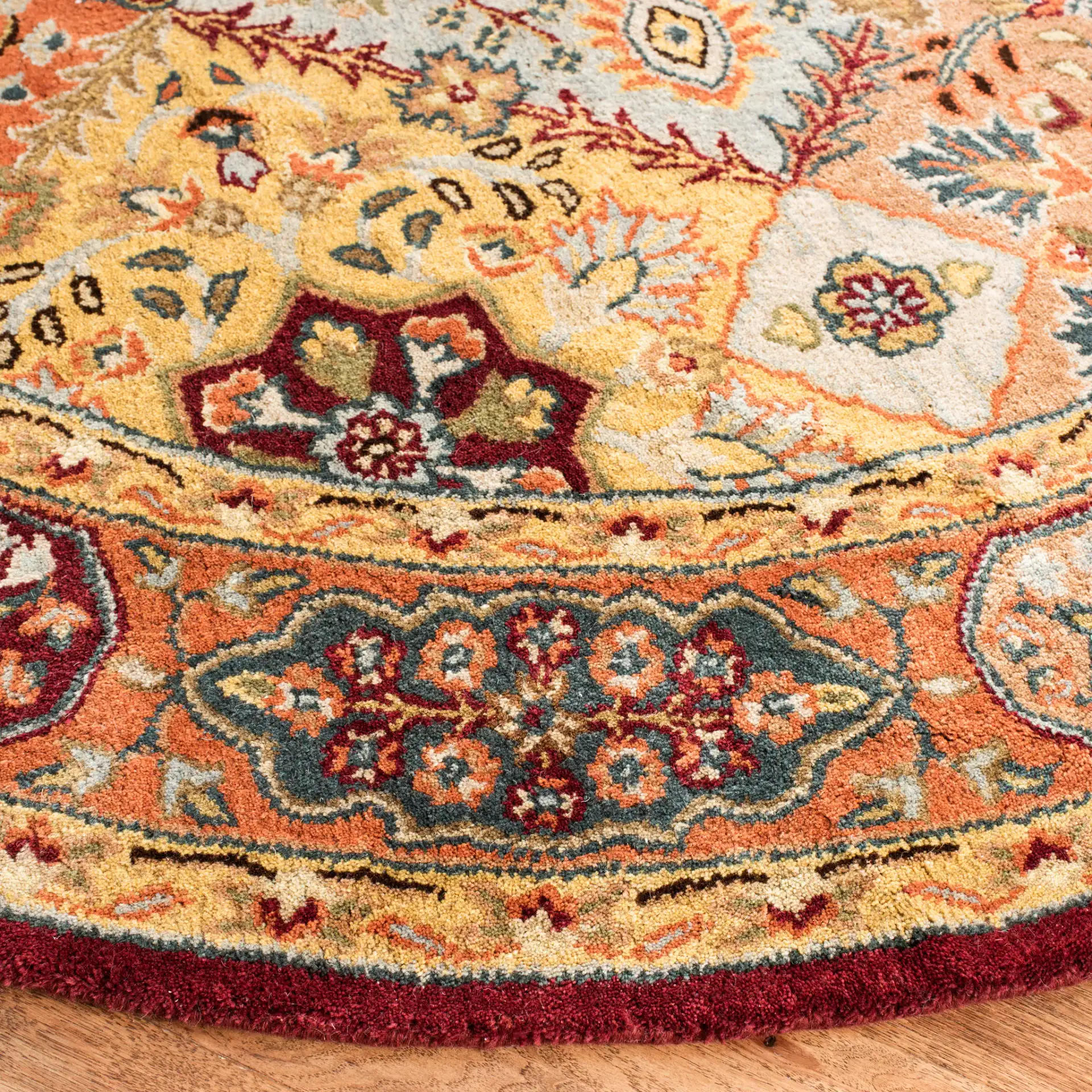 Persian Legend Floral Tile Hand-Tufted Wool Rug in Red / Rust in a styled room