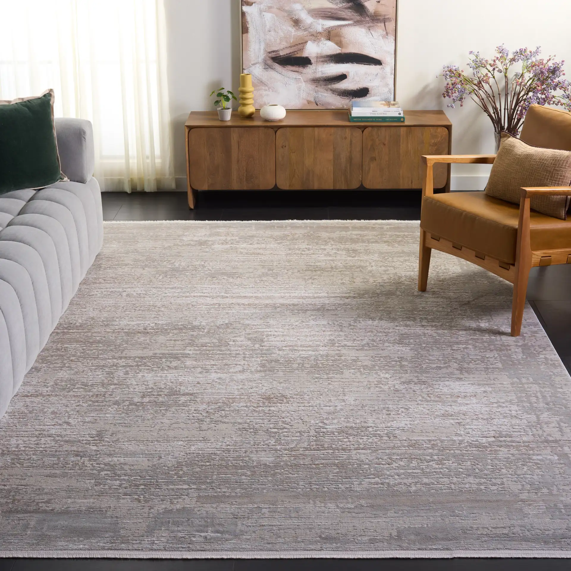 Platinum Distressed Border Rug in Gray / Beige in a styled room