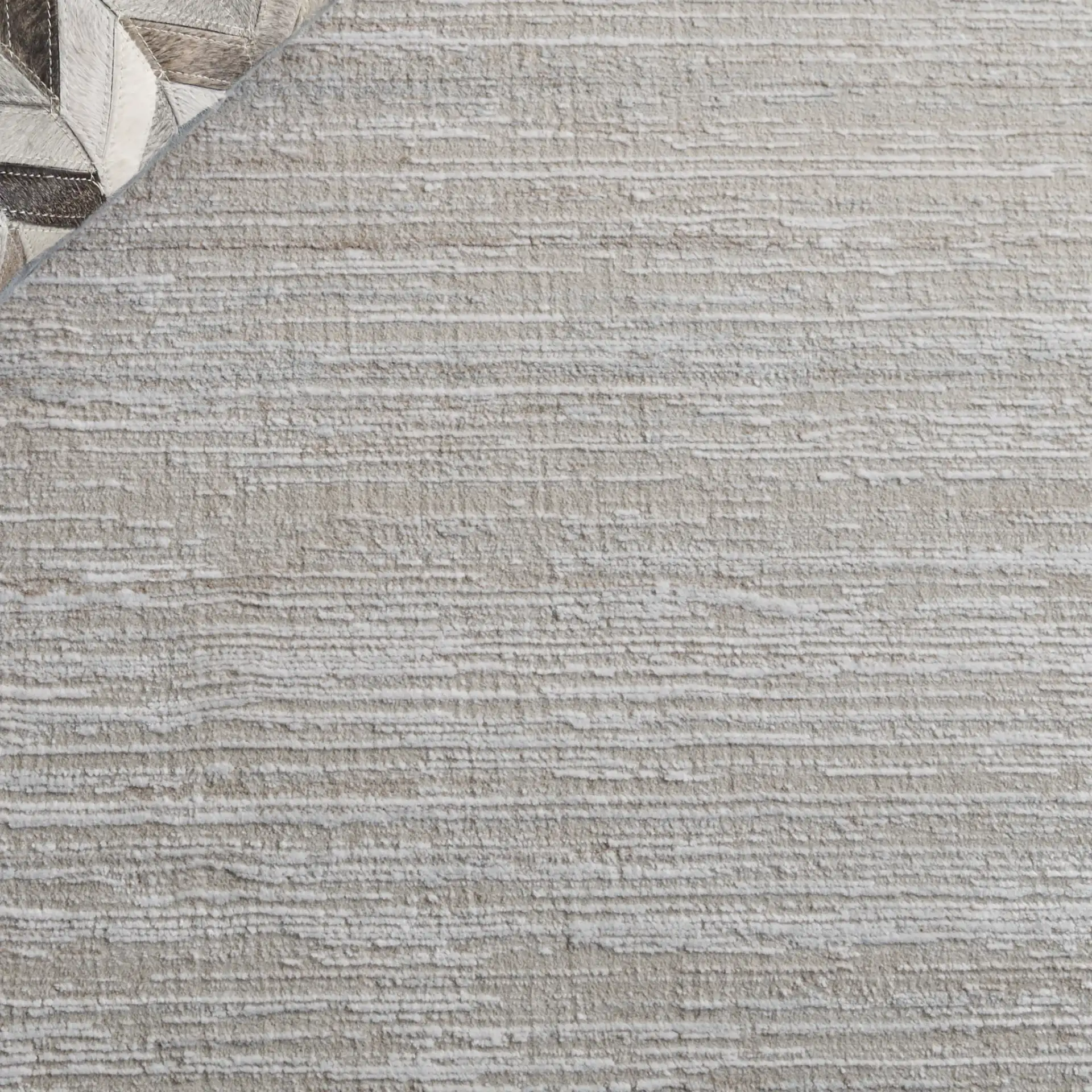 Platinum Striated Rug in Beige / Ivory in a styled room