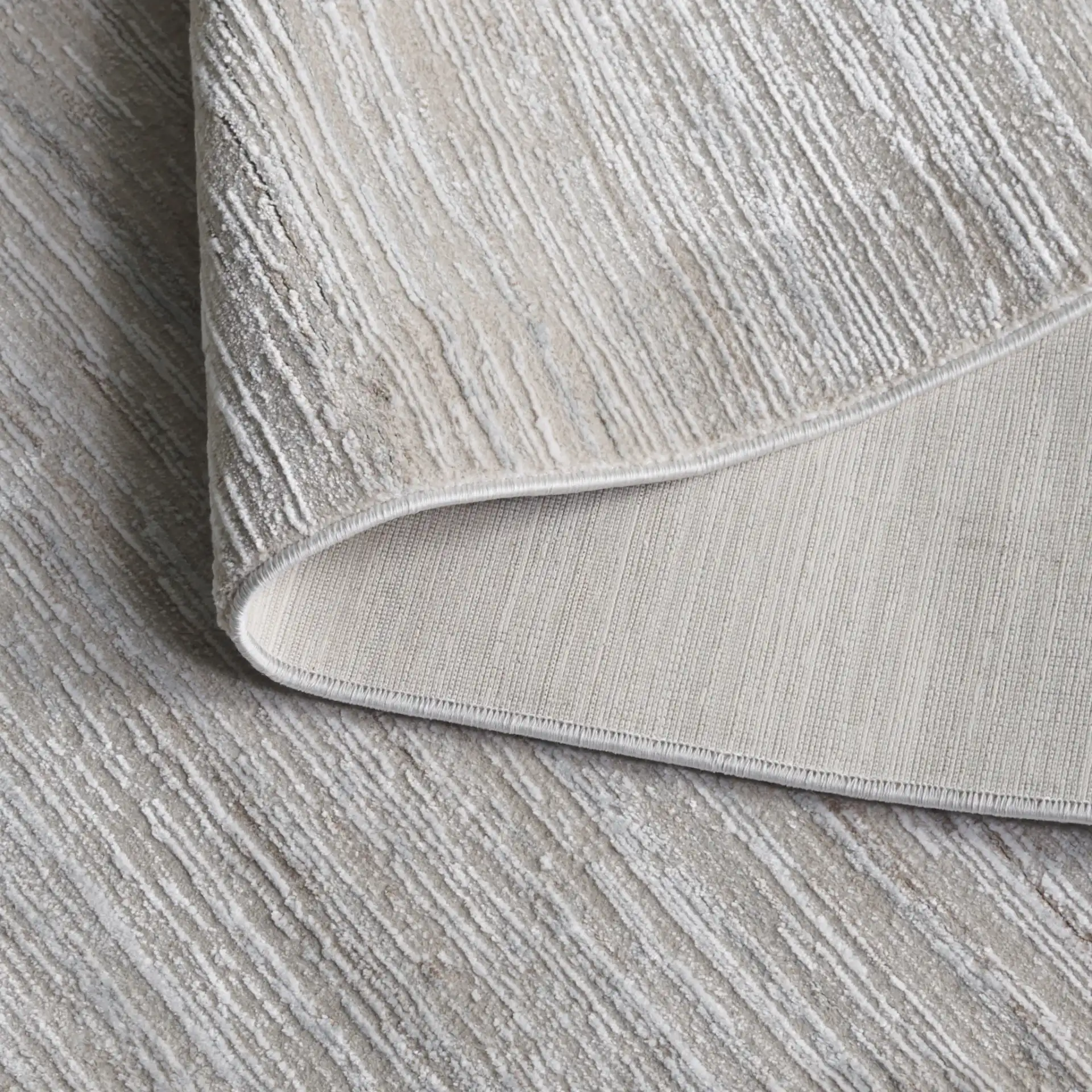 Platinum Striated Rug in Beige / Ivory in a styled room