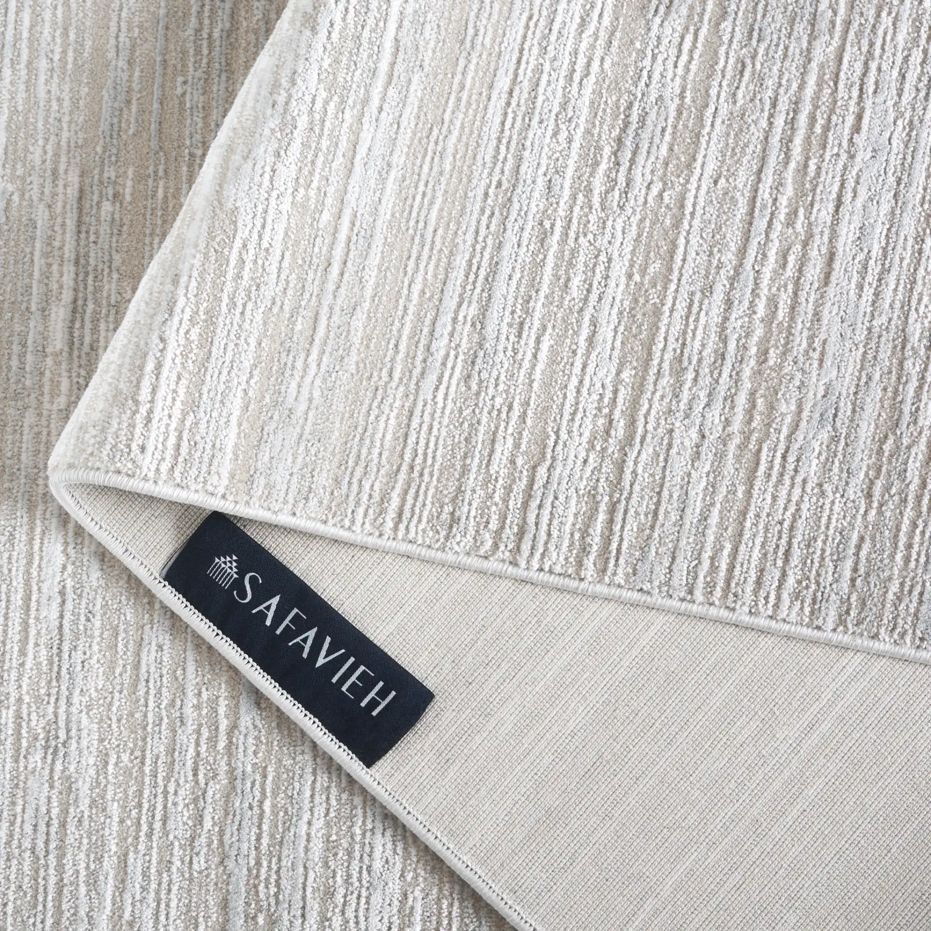 Platinum Linear Stripe Rug in Beige / Ivory in a styled room