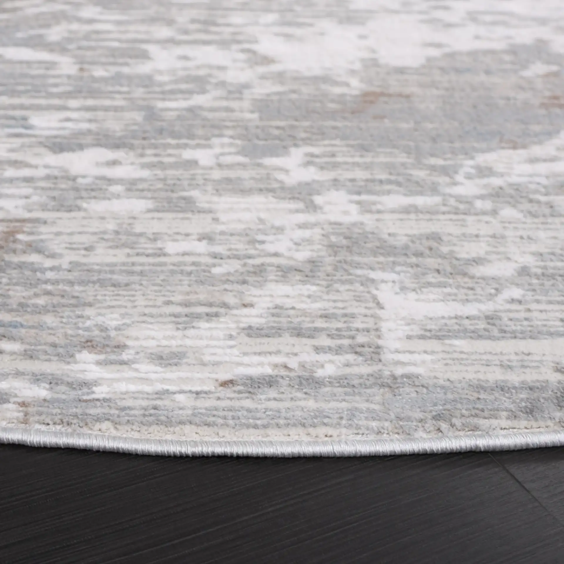 Platinum Distressed Abstract Rug in Gray / Ivory in a styled room