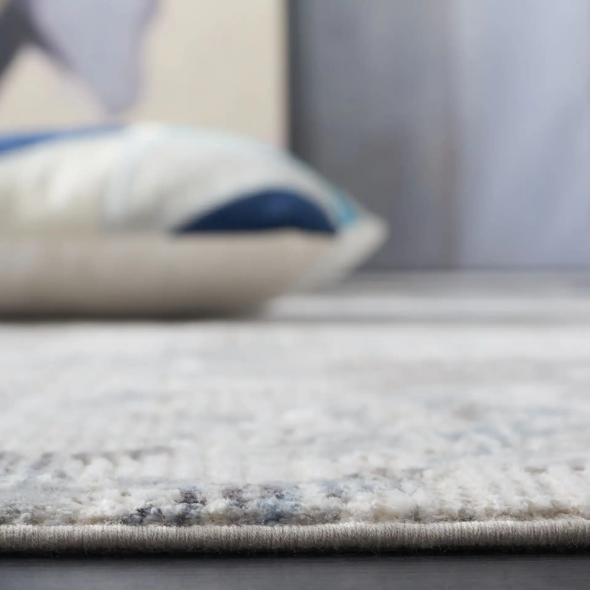 Platinum Distressed Abstract Rug in Gray / Ivory in a styled room