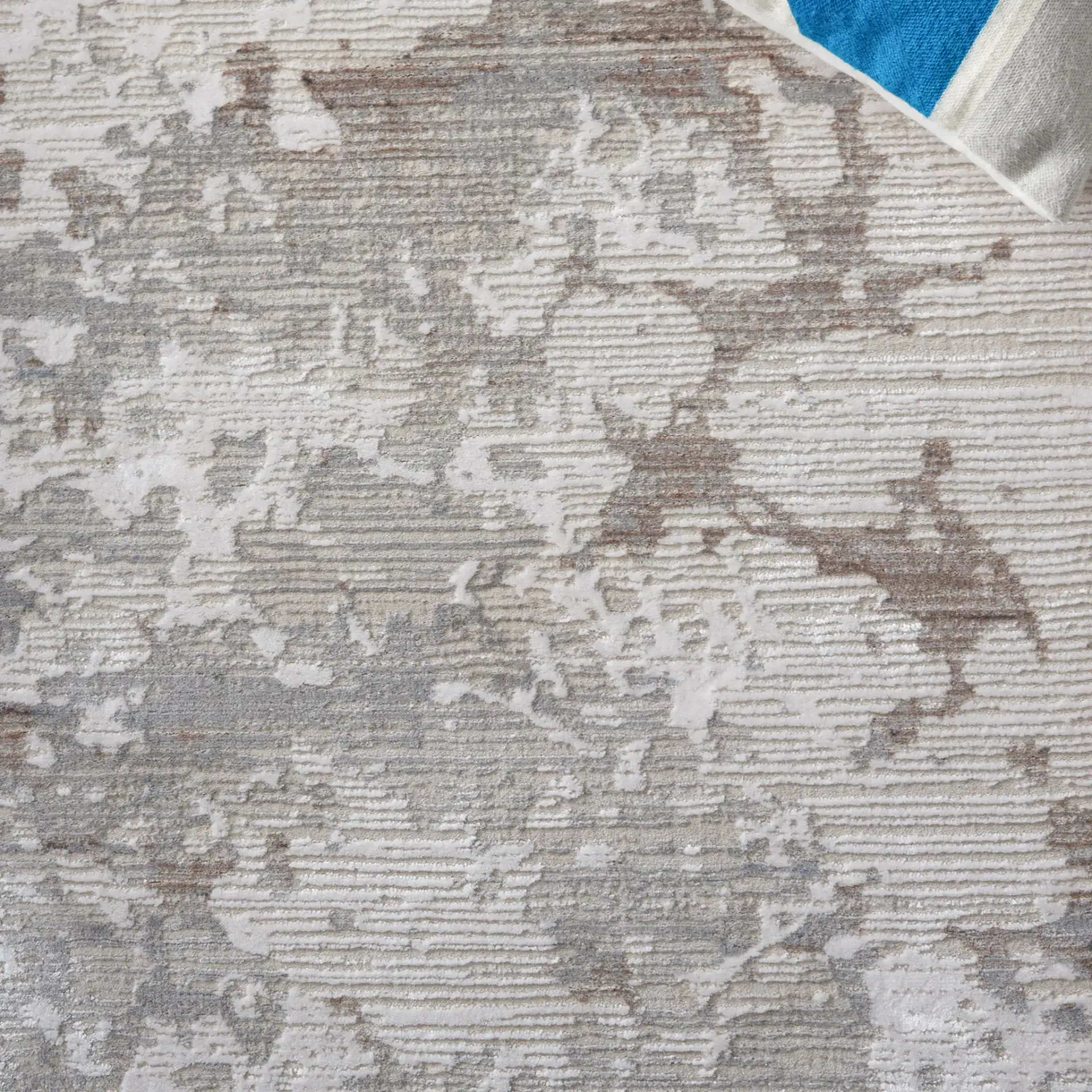 Platinum Distressed Abstract Rug in Gray / Ivory in a styled room