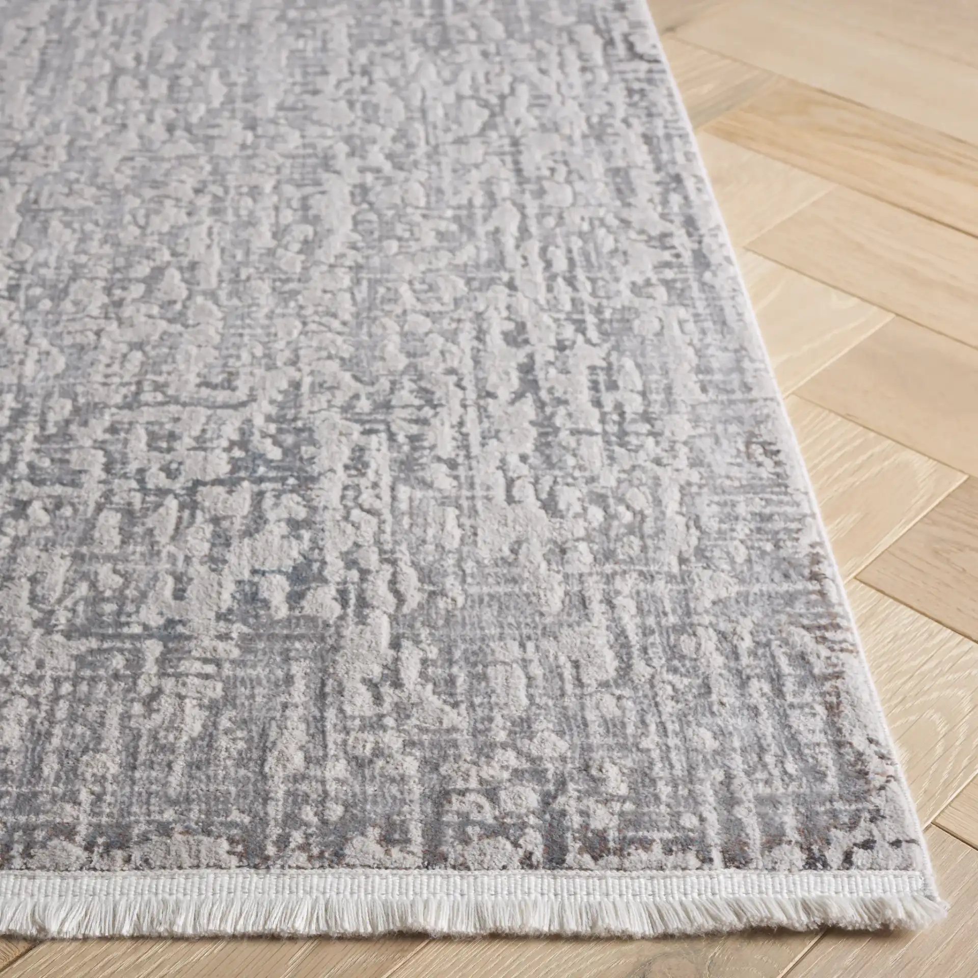 Platinum Distressed Texture Rug in Gray / Beige in a styled room
