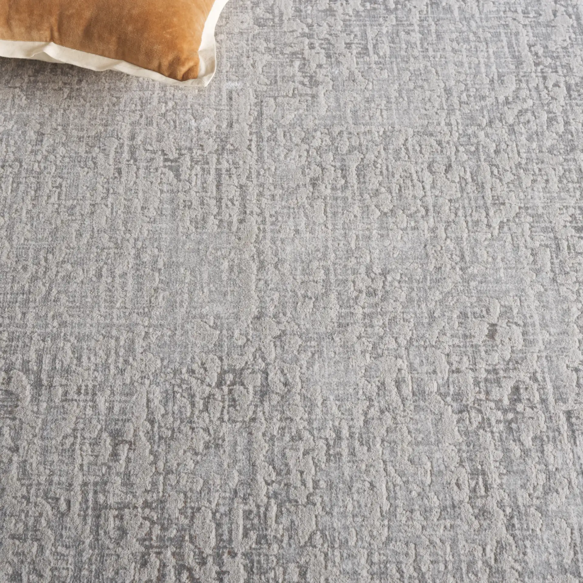Platinum Distressed Texture Rug in Gray / Beige in a styled room