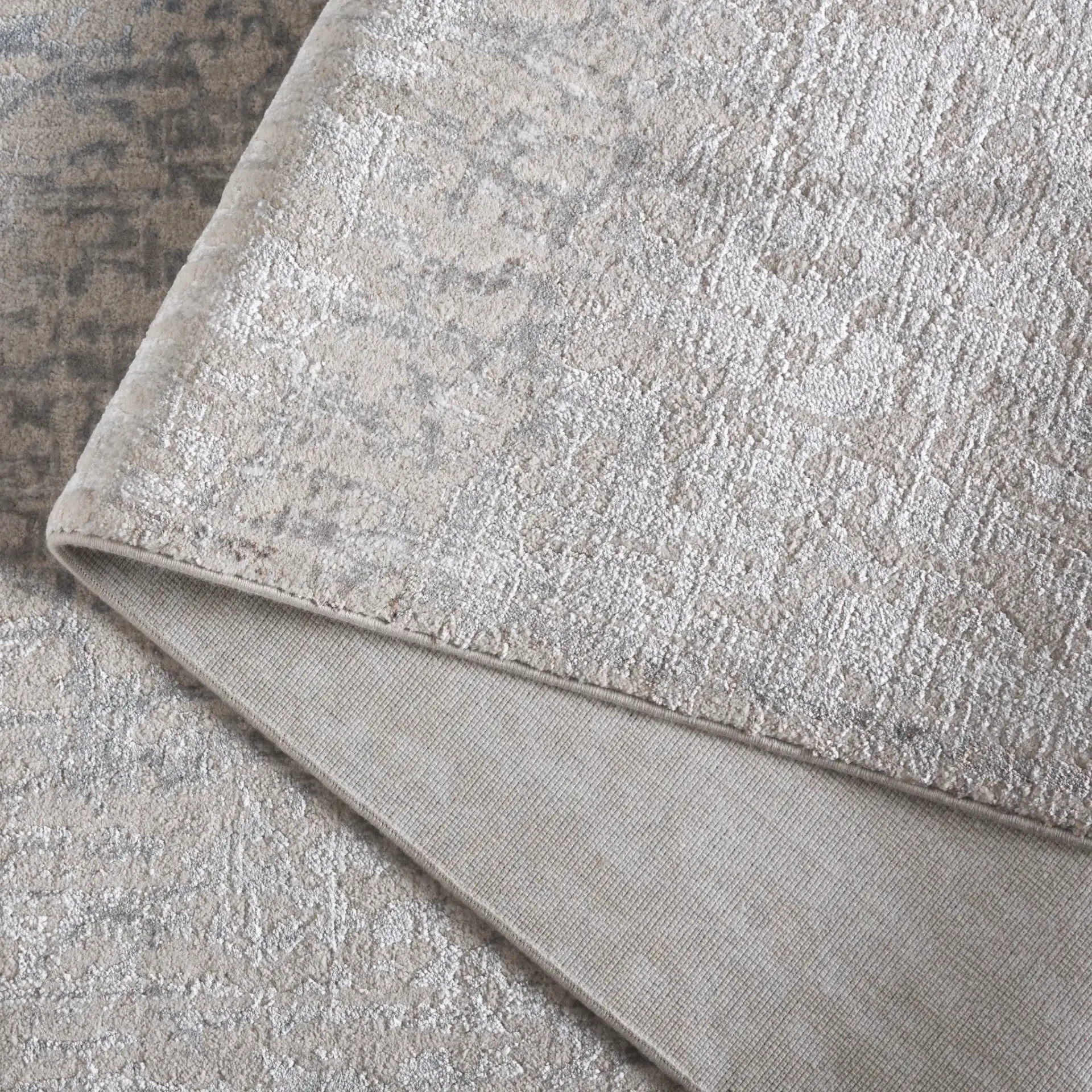 Platinum Distressed Texture Rug in Gray / Beige in a styled room