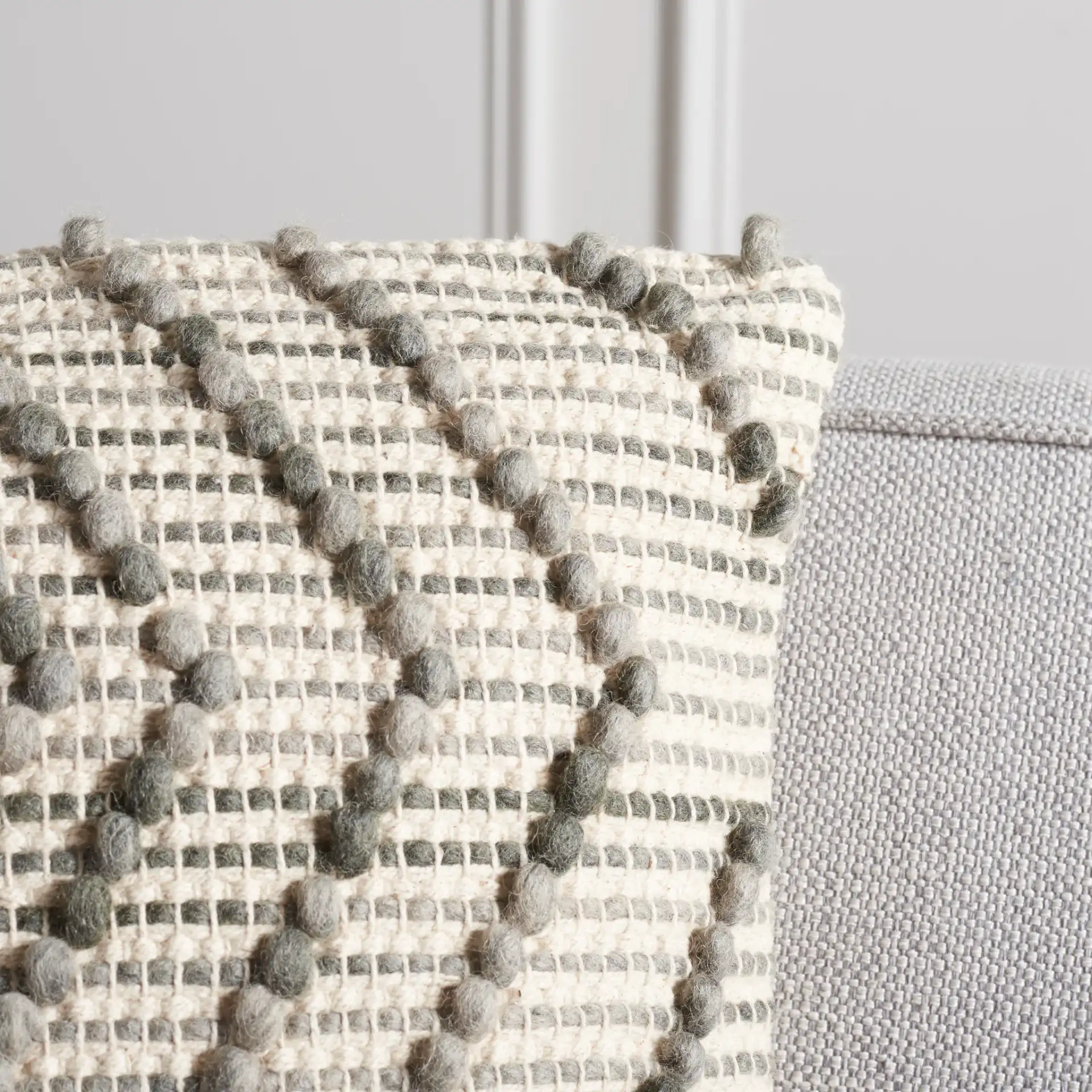 Adalia Pillow in Gray in a styled room