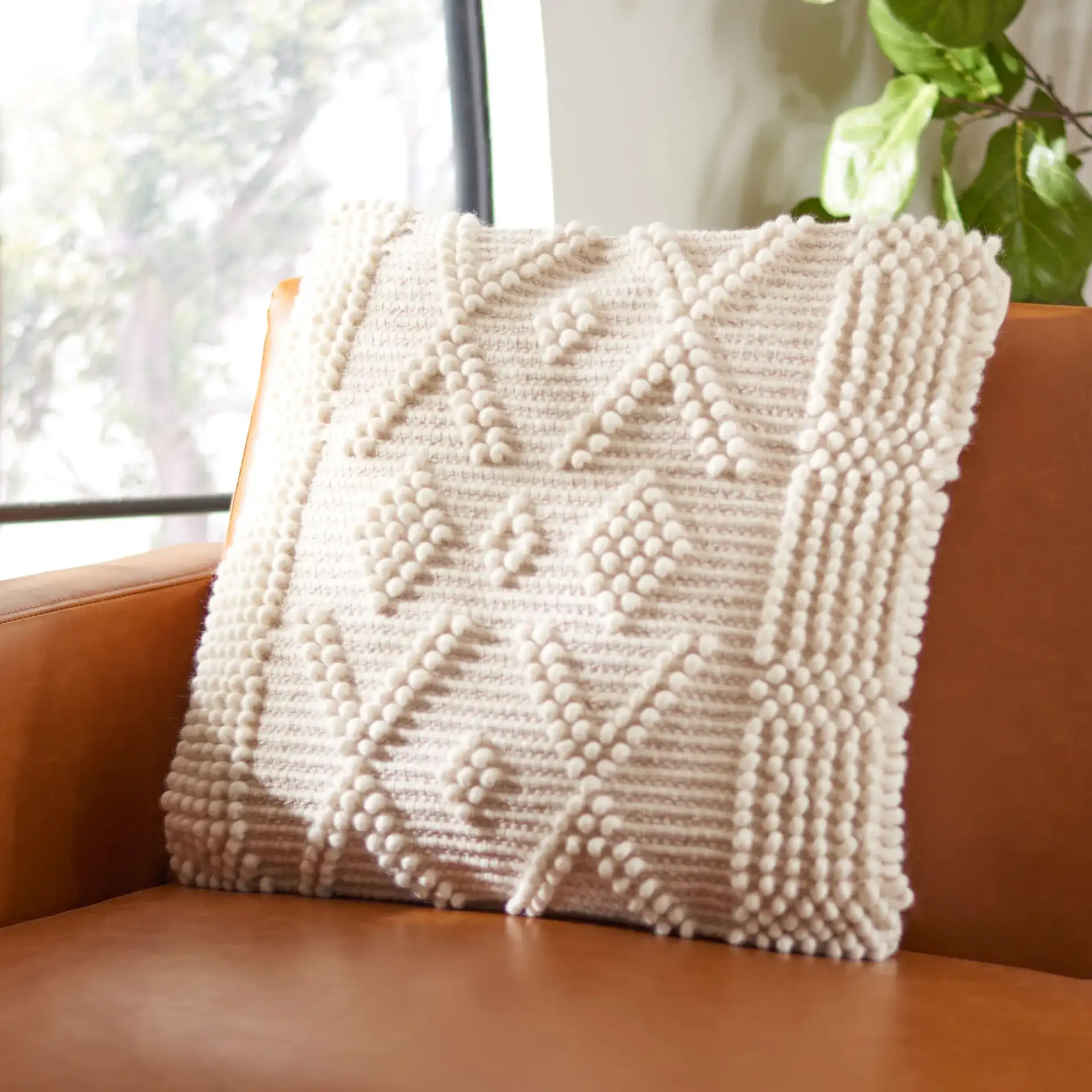 Baird Pillow in Ivory in a styled room