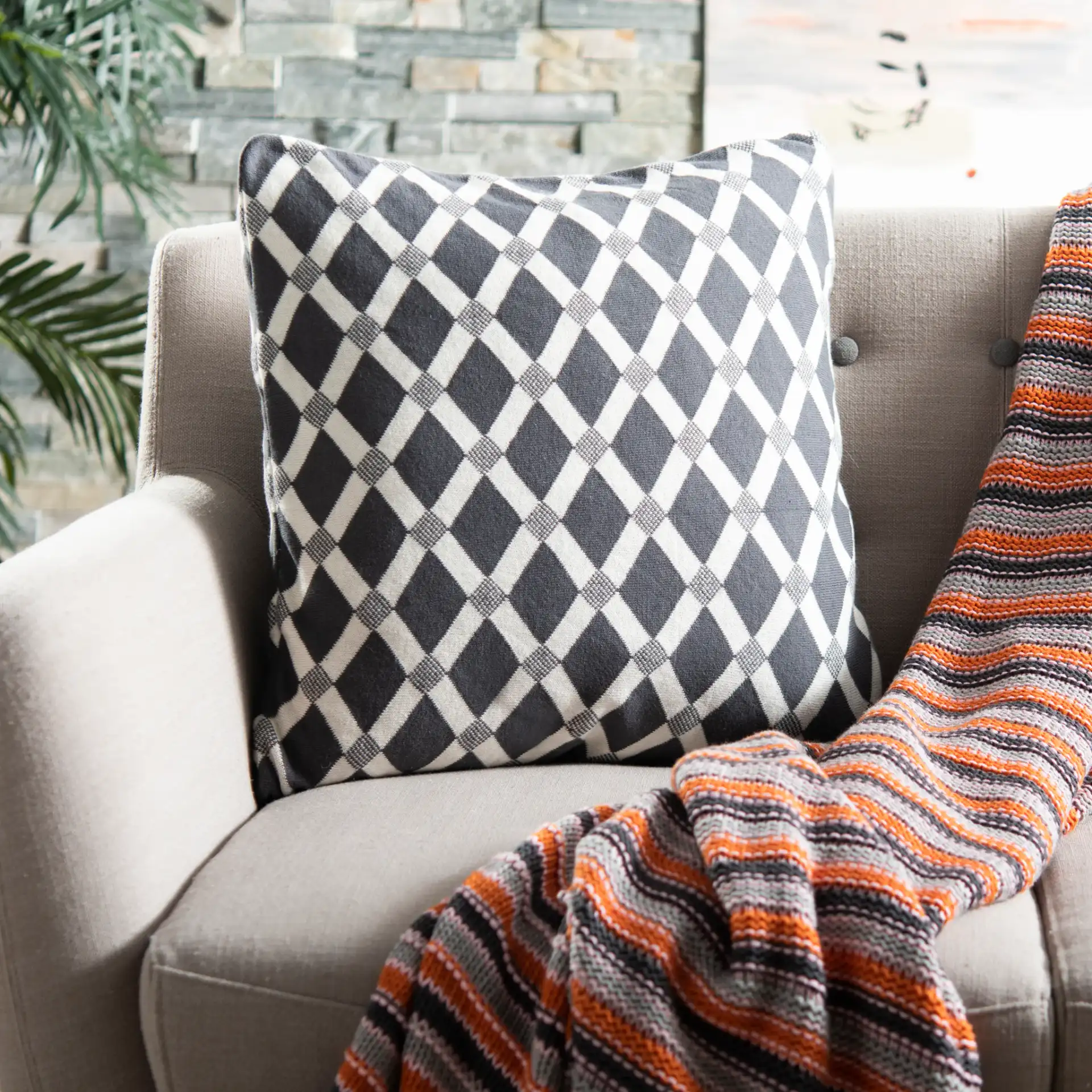 Diamond Knit Pillow in Dark Gray / Natural in a styled room