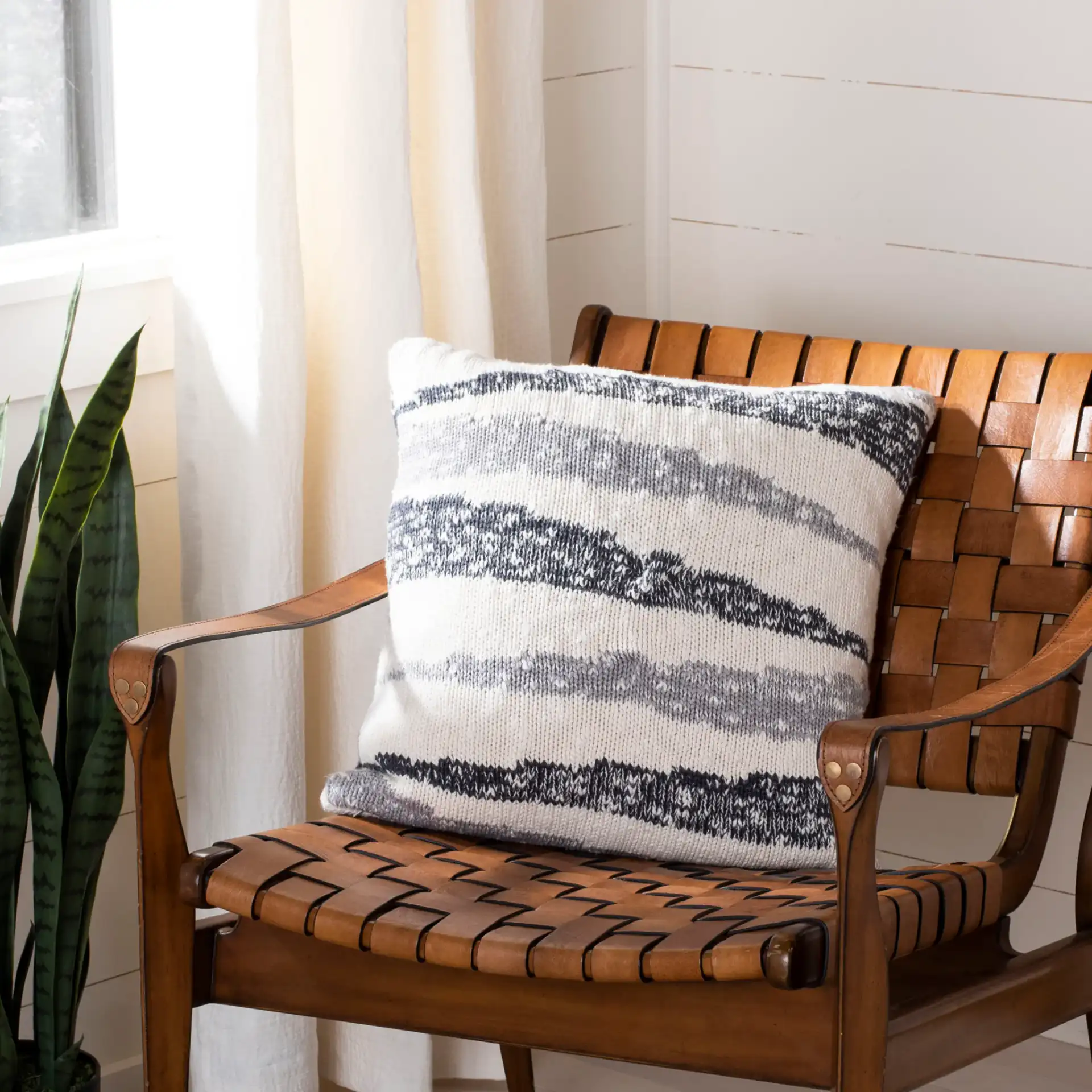Imani Knit Pillow in Dark Gray / Light Gray / Natural in a styled room