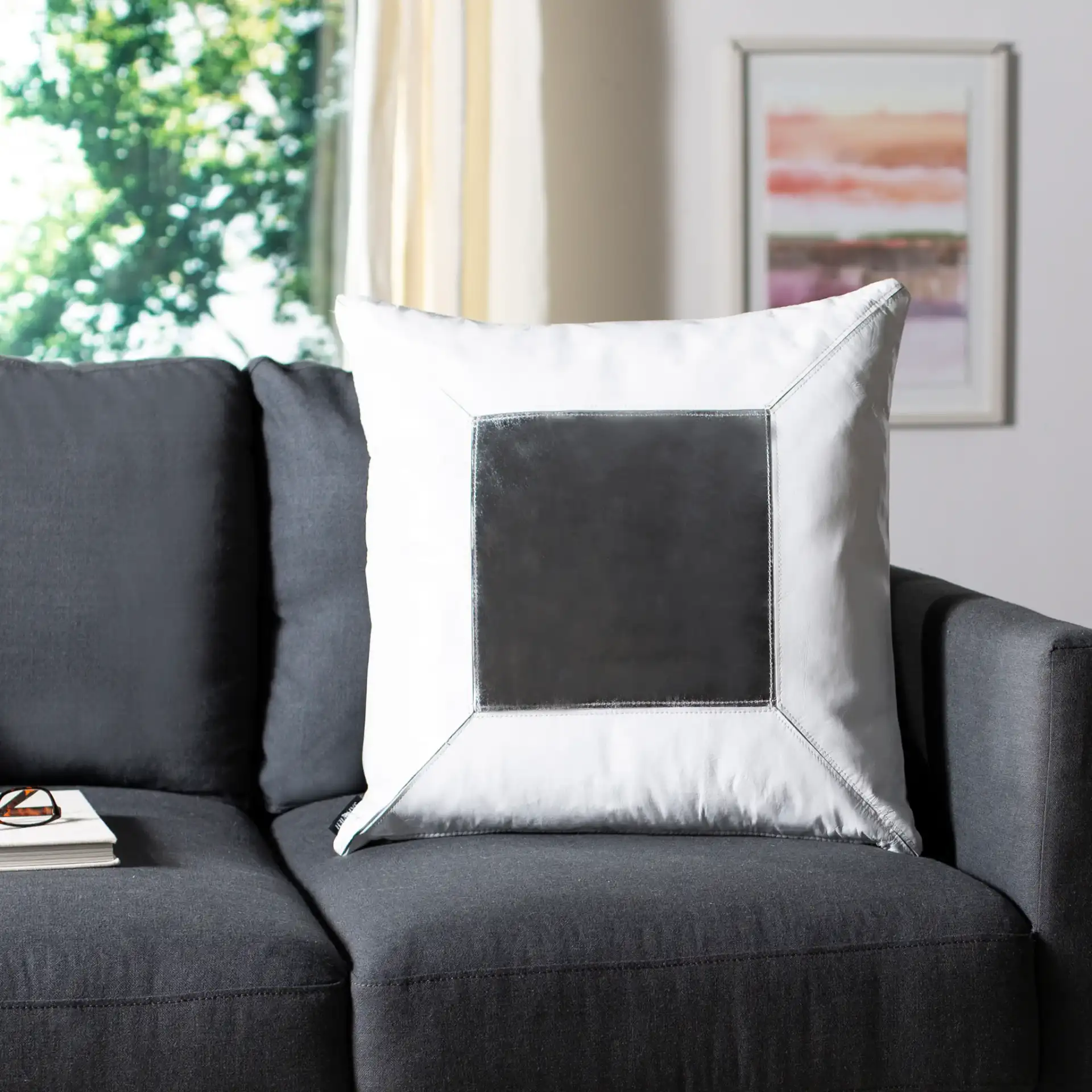 Tinsley Cowhide Pillow in White / Silver in a styled room