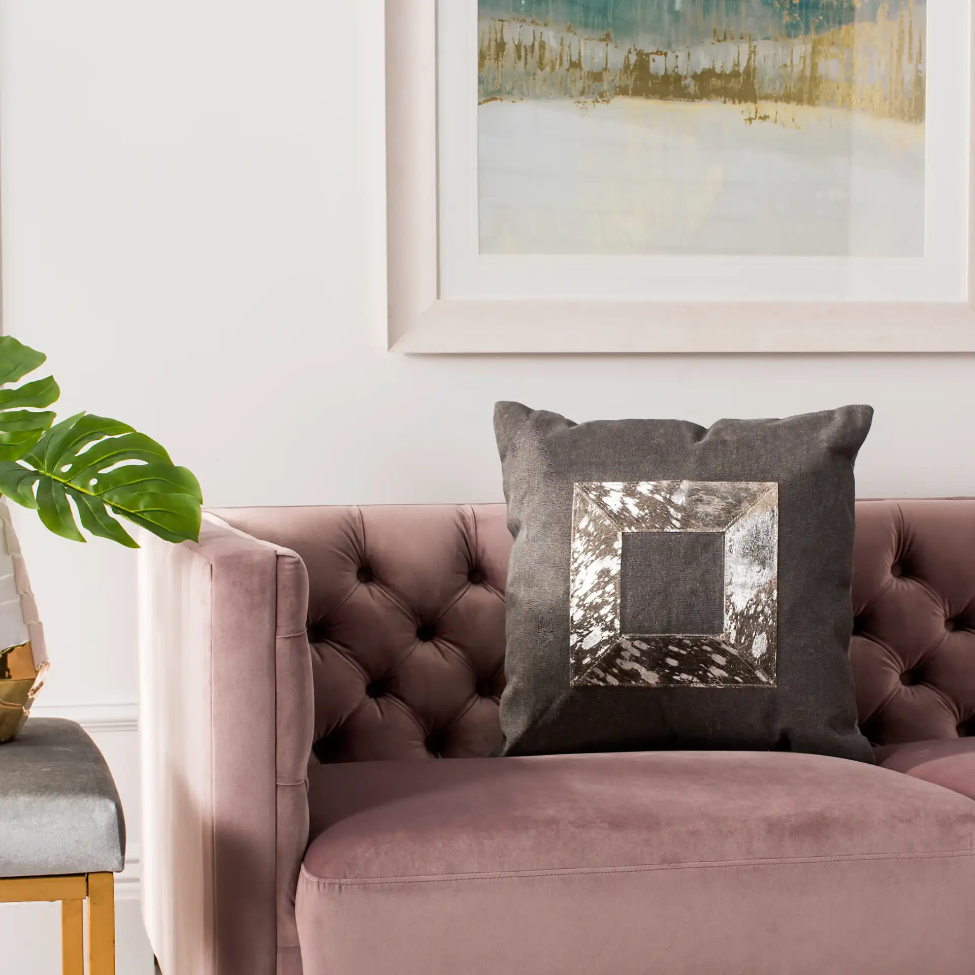 Grayer Metallic Cowhide Pillow in Gray / Silver in a styled room