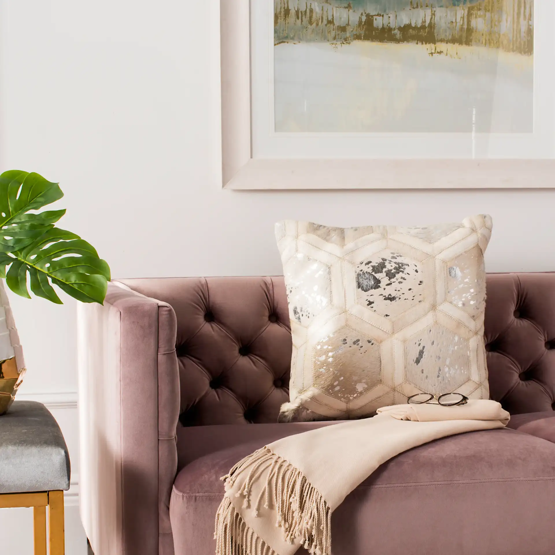 Maggie Metallic Cowhide Pillow in White / Silver in a styled room