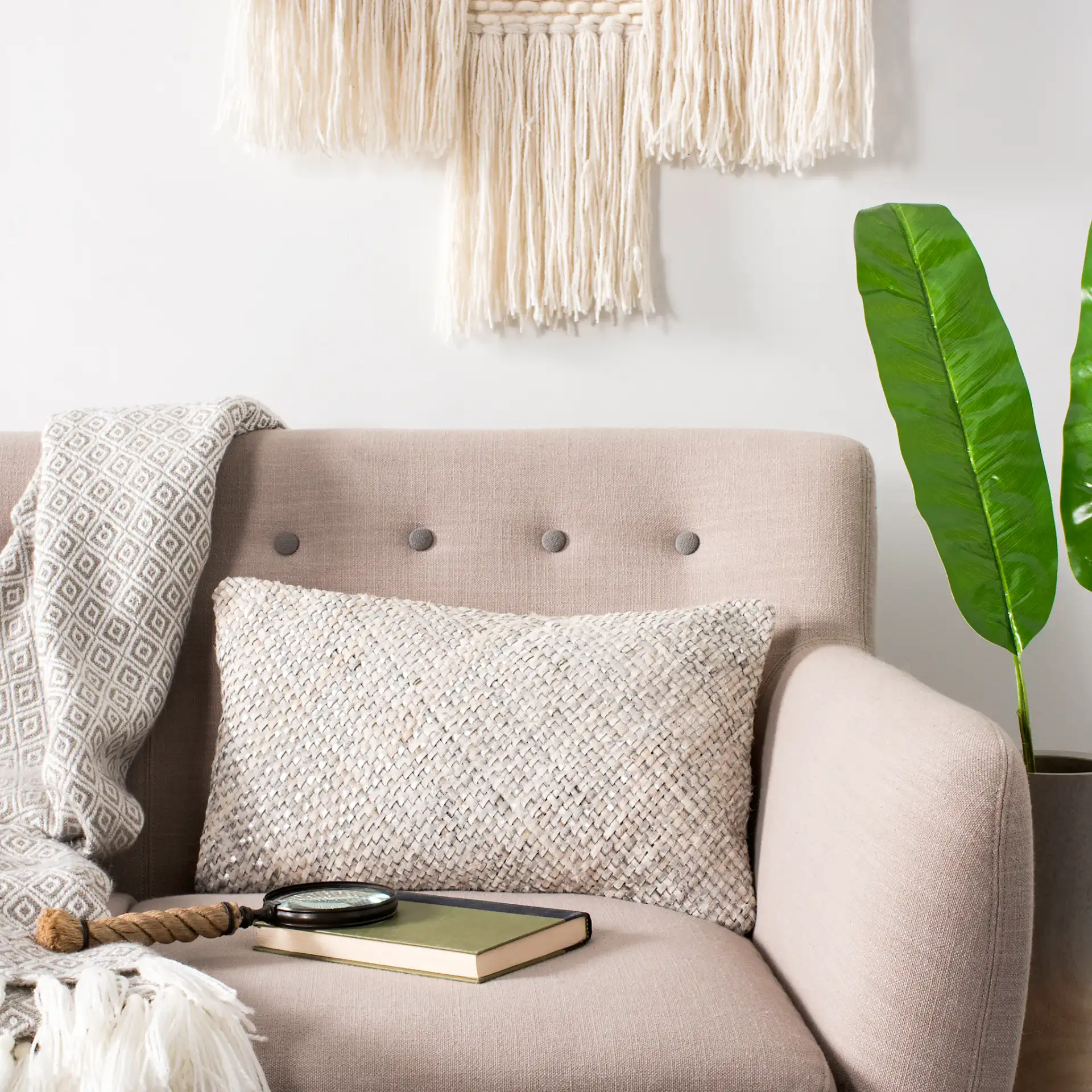 Shelby Cowhide Pillow in White in a styled room