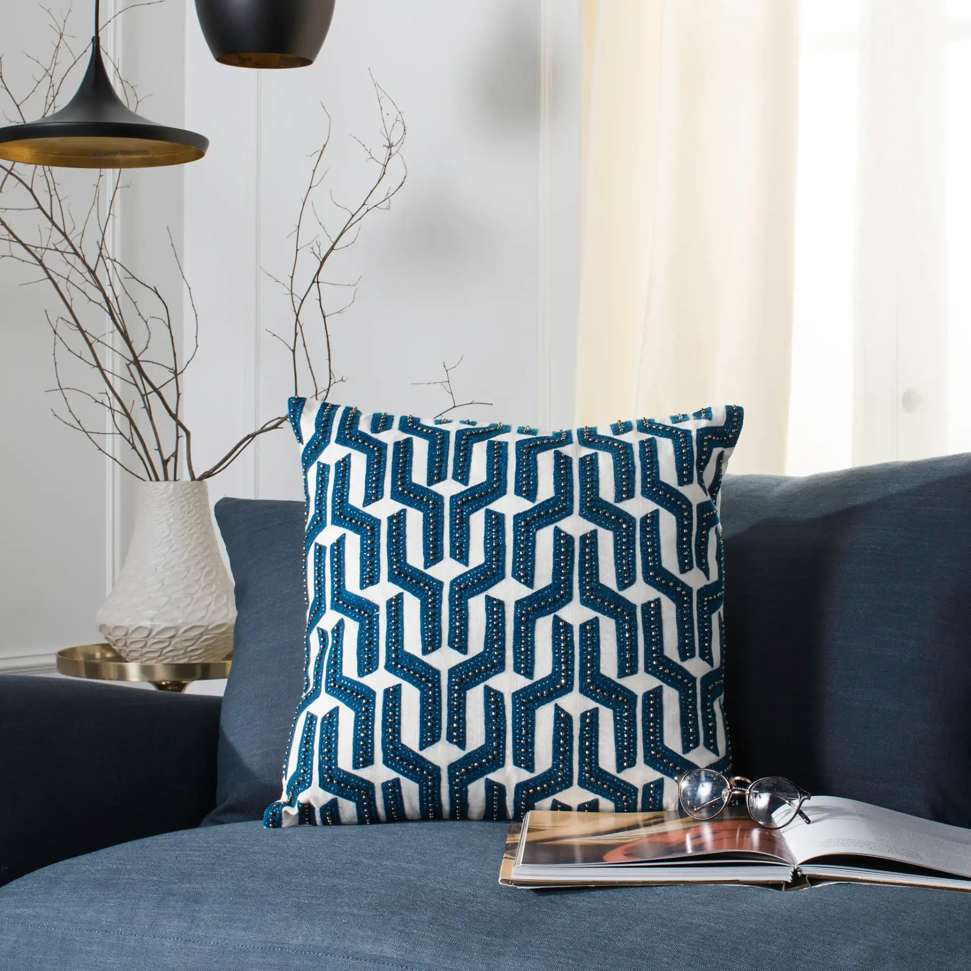 Chauncy Pillow in Navy Blue / White in a styled room