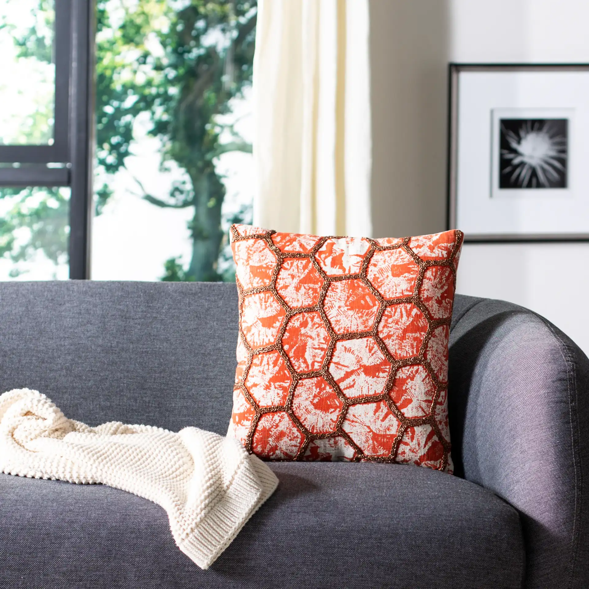 Falla Pillow in Orange / White in a styled room