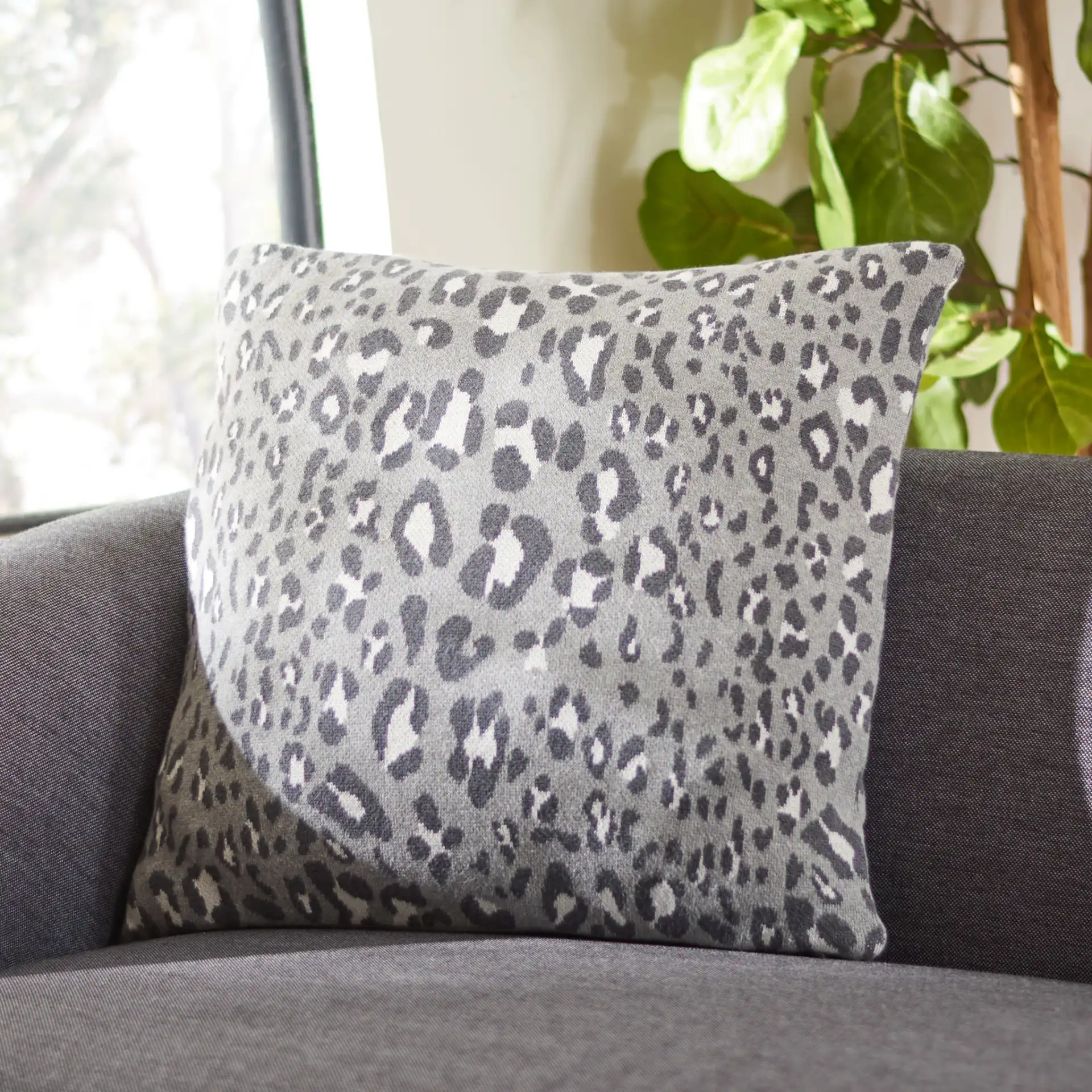 Kasya Leopard Pillow in Gray / Black in a styled room