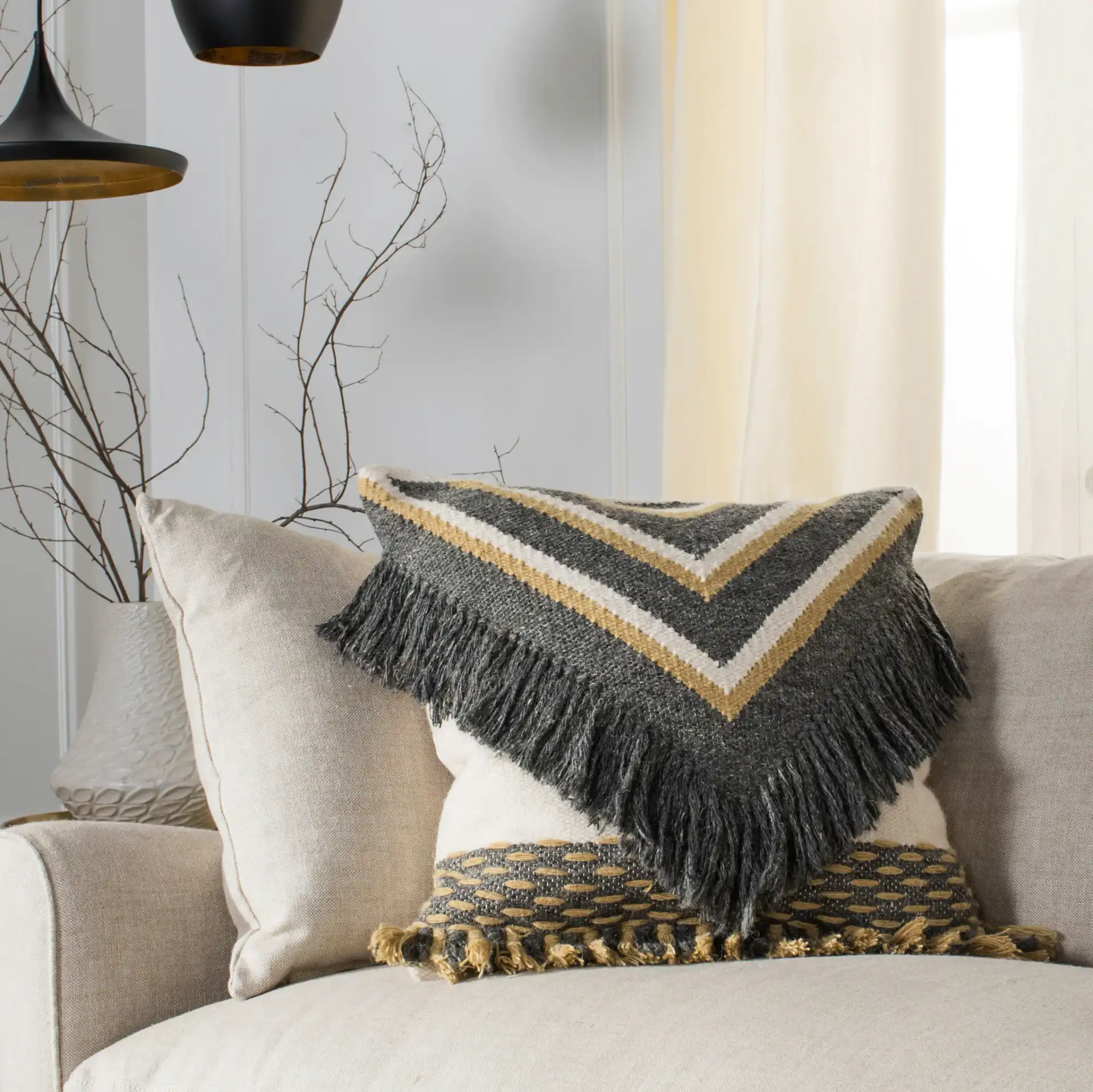 Elettra Pillow in Charcoal / Gold in a styled room