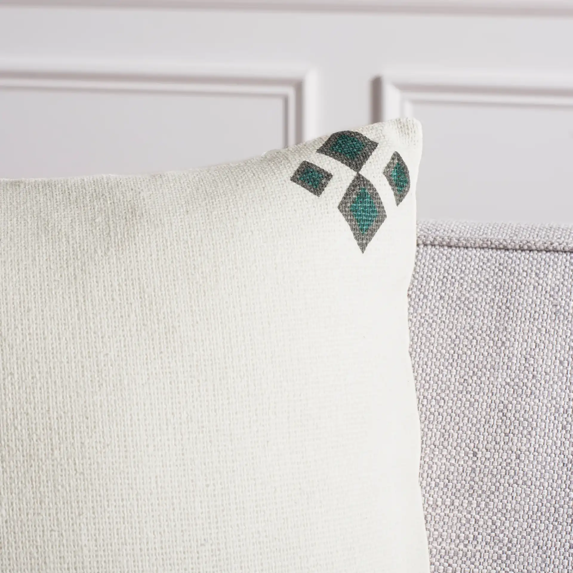 Lancia Pillow in Beige / Taupe / Turquoise in a styled room