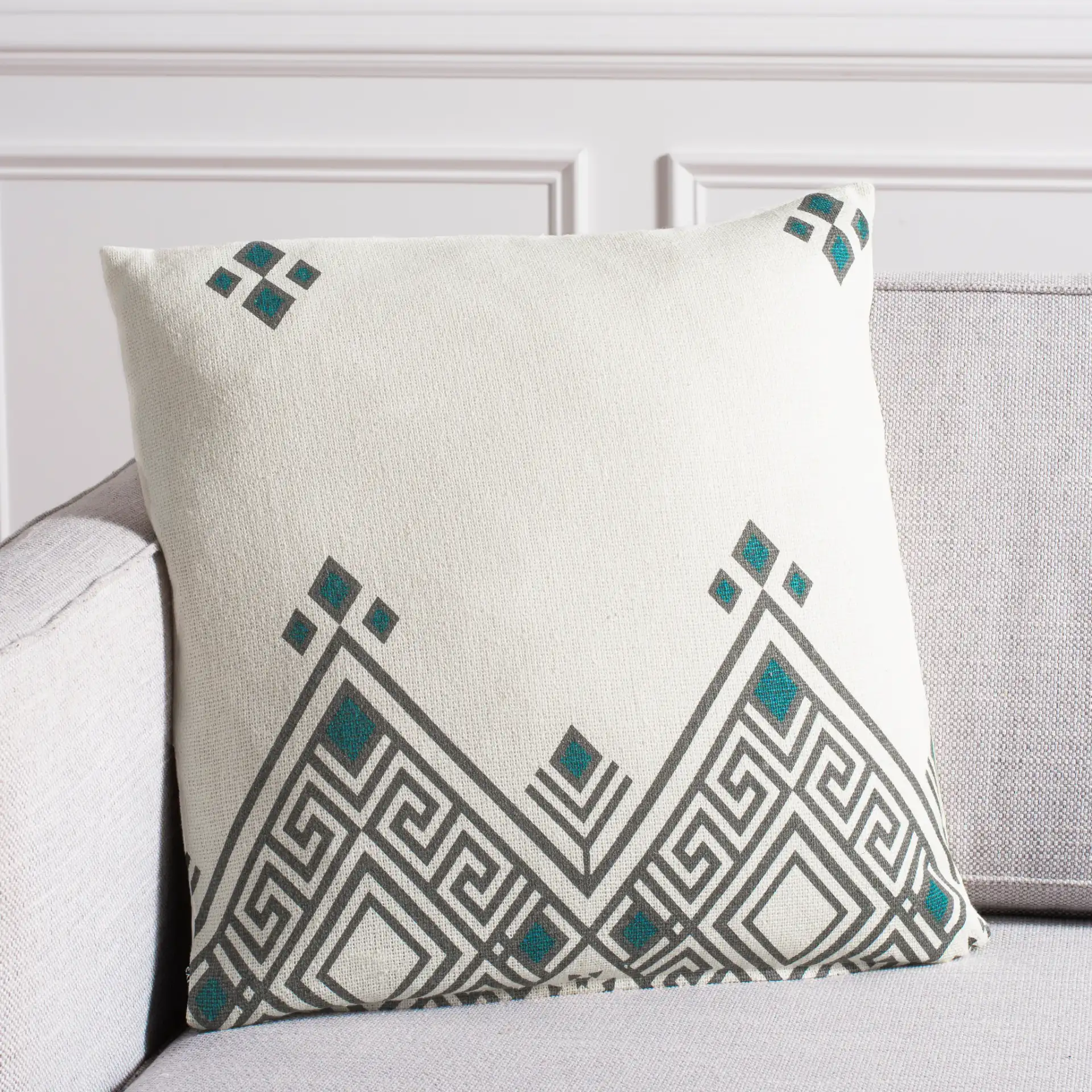 Lancia Pillow in Beige / Taupe / Turquoise in a styled room