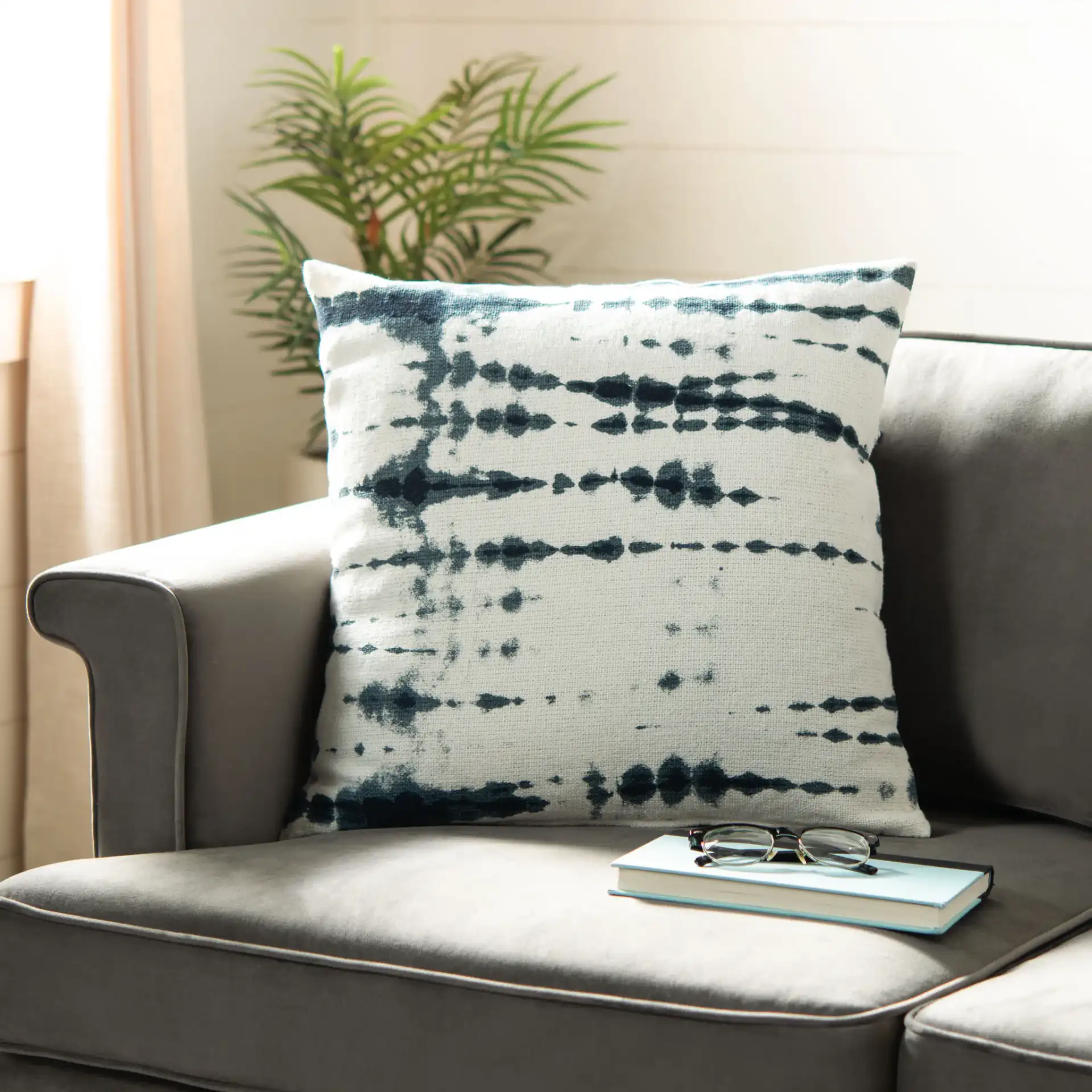Arya Pillow in Beige / Navy in a styled room