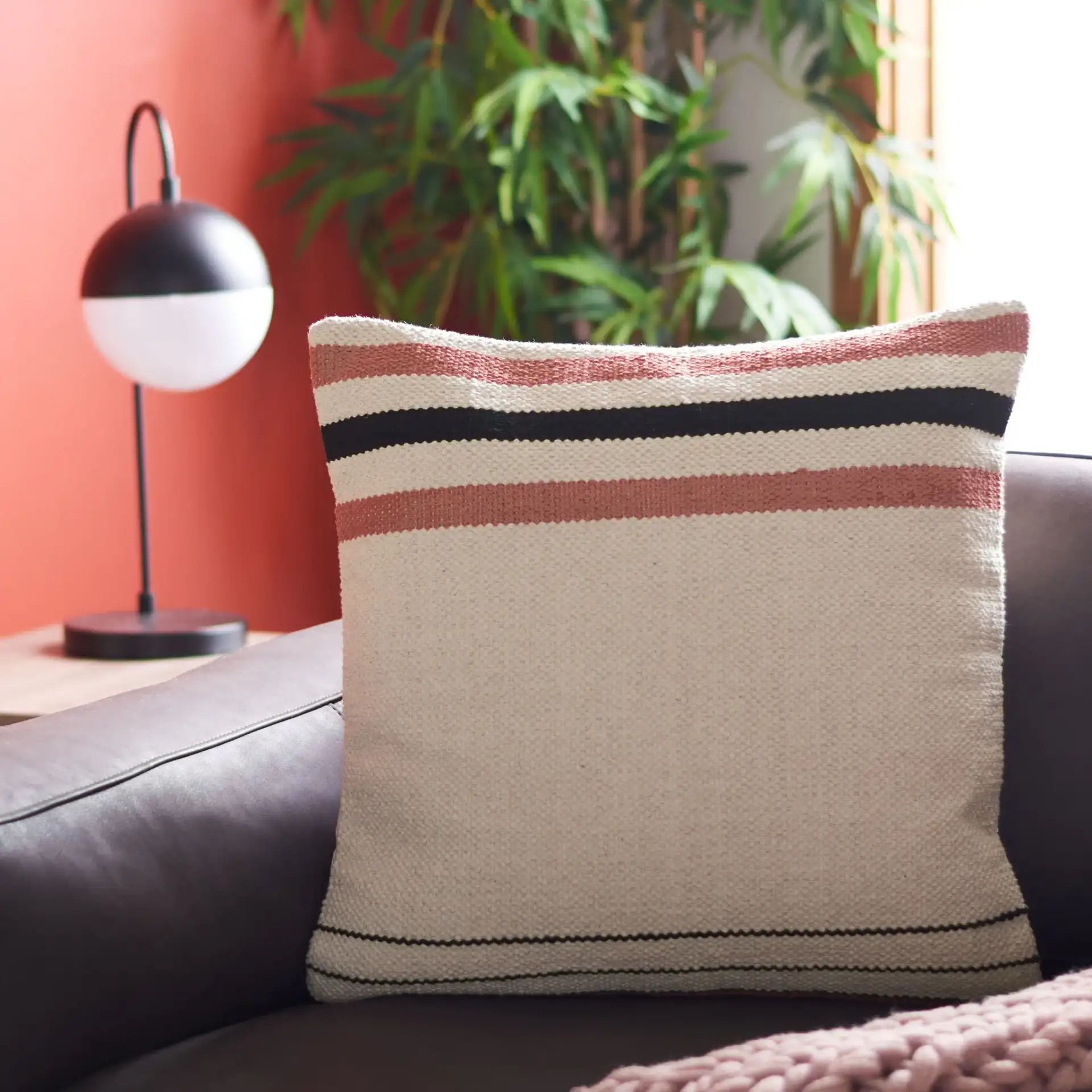 Thiele Pillow in Rust / Beige in a styled room