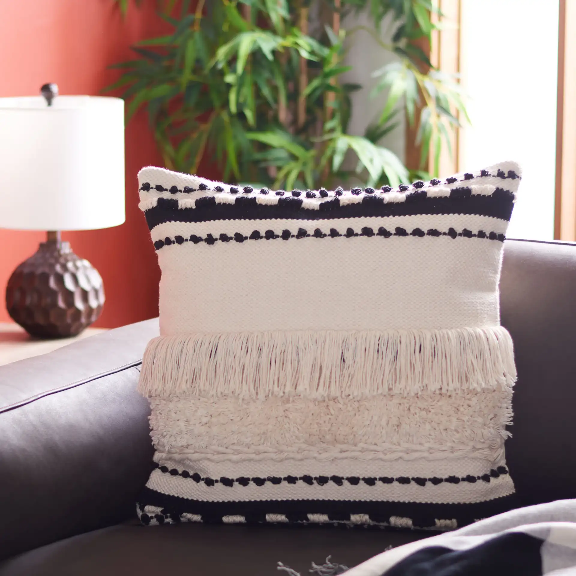 Vanka Pillow in Beige / Black in a styled room