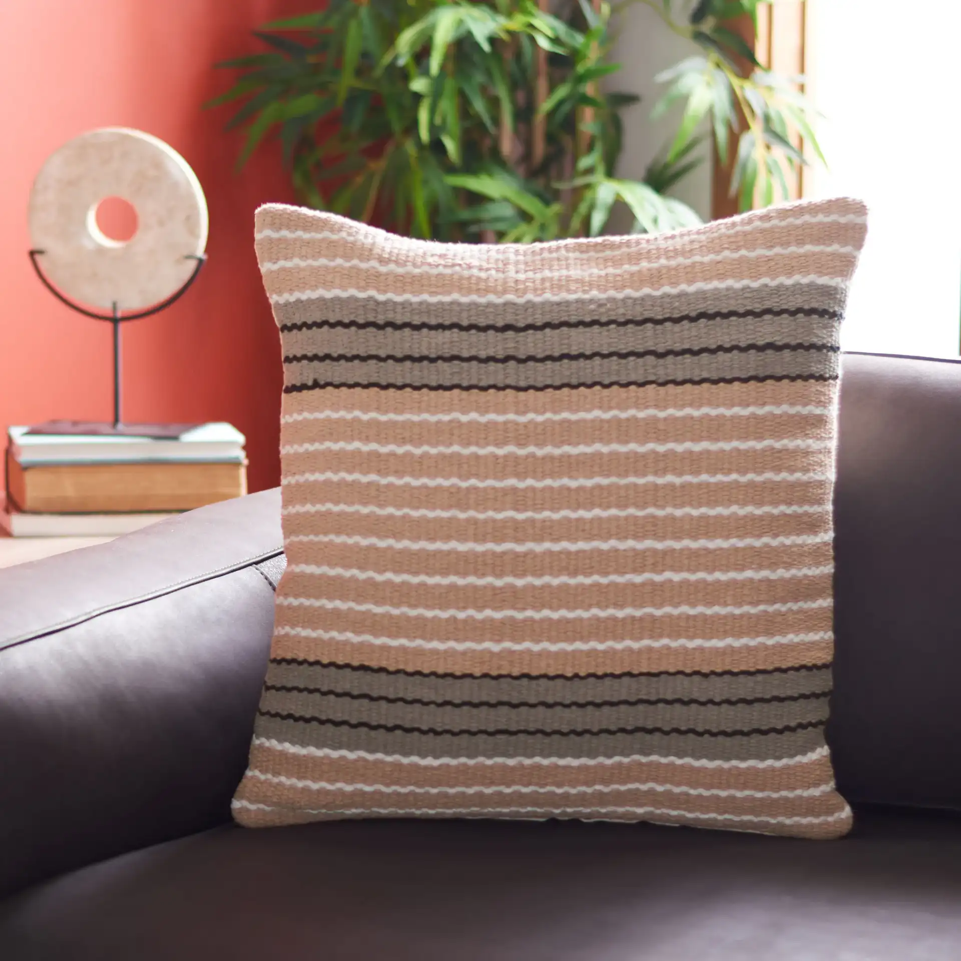 Jendi Pillow in Brown / Gray in a styled room