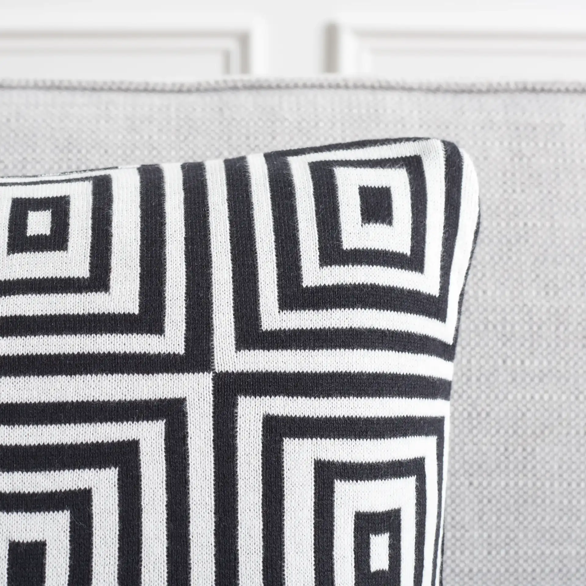 Veda Pillow (Set Of 2) in Black / Ivory in a styled room