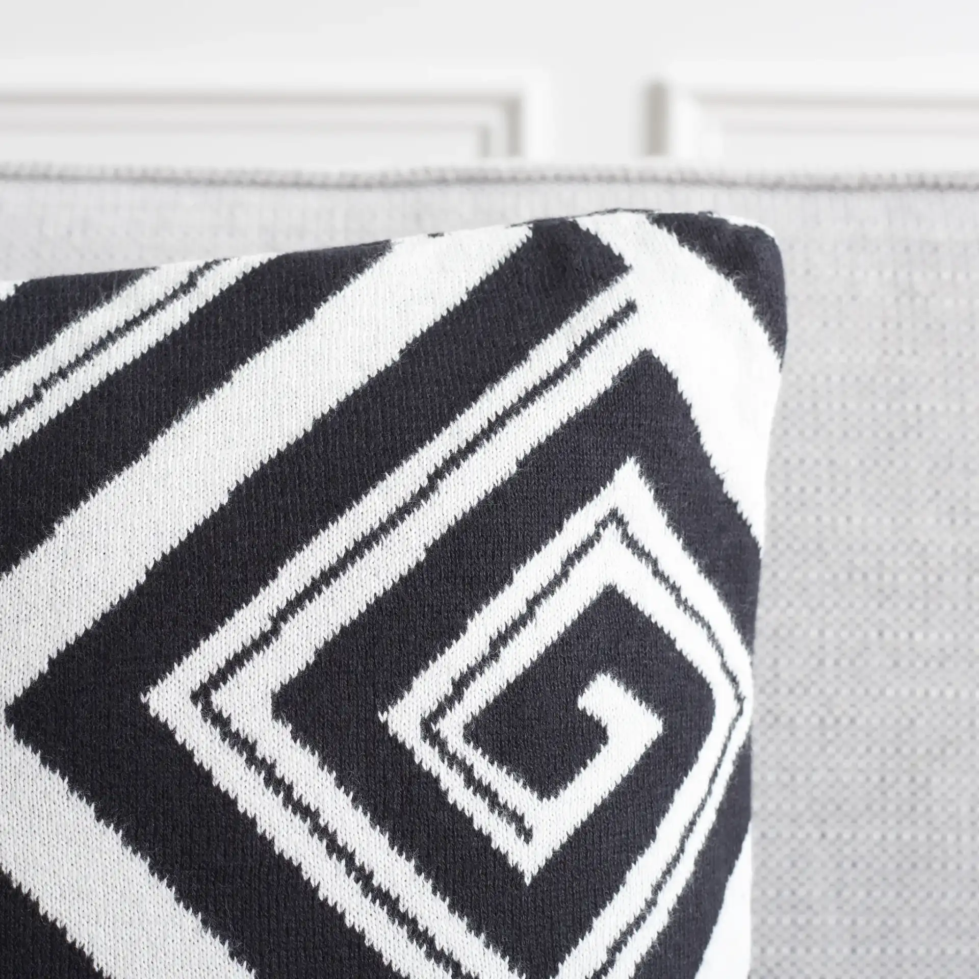 Nova Pillow (Set of 2) in Black / Ivory in a styled room
