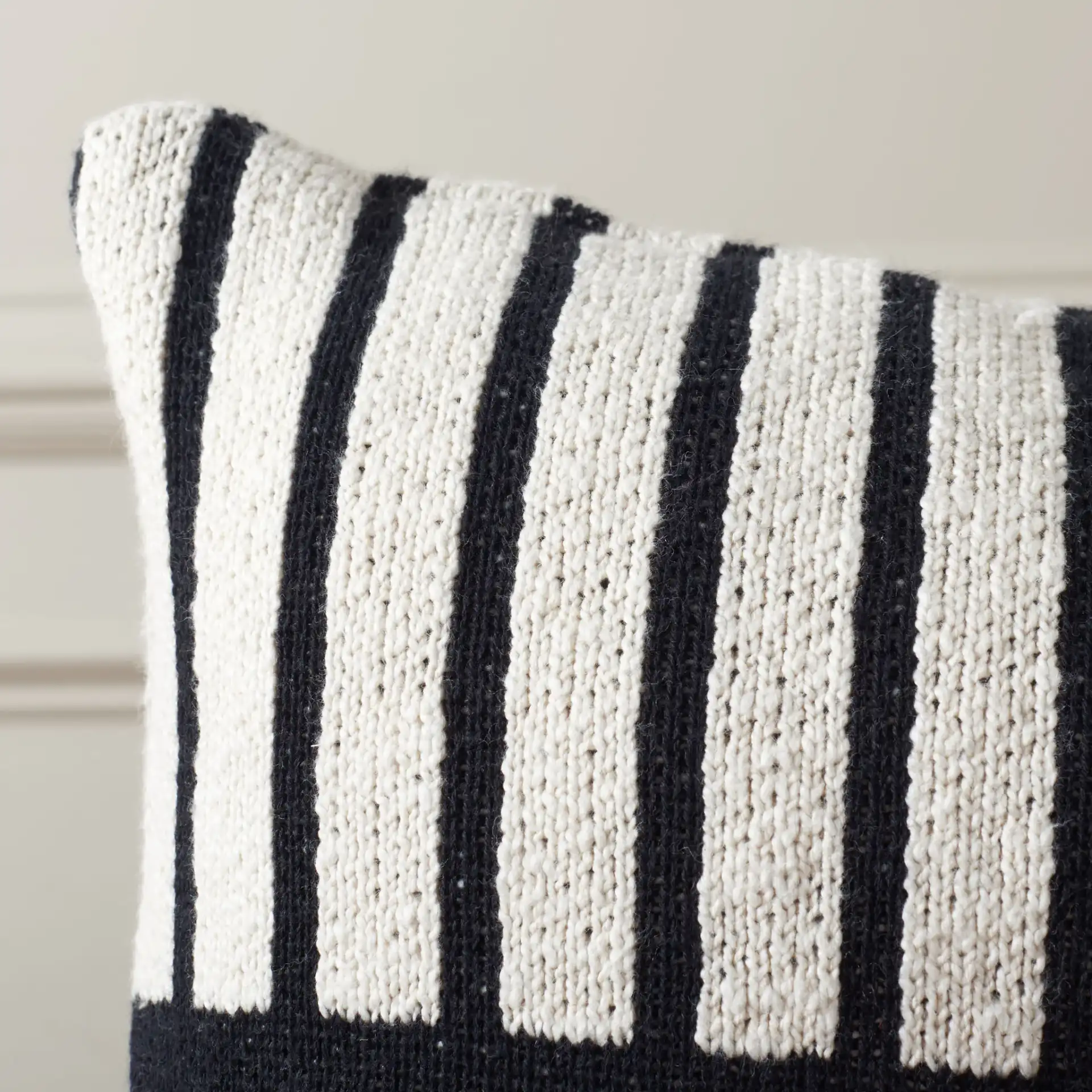 Drew Lumbar Pillow in Ivory / Black in a styled room