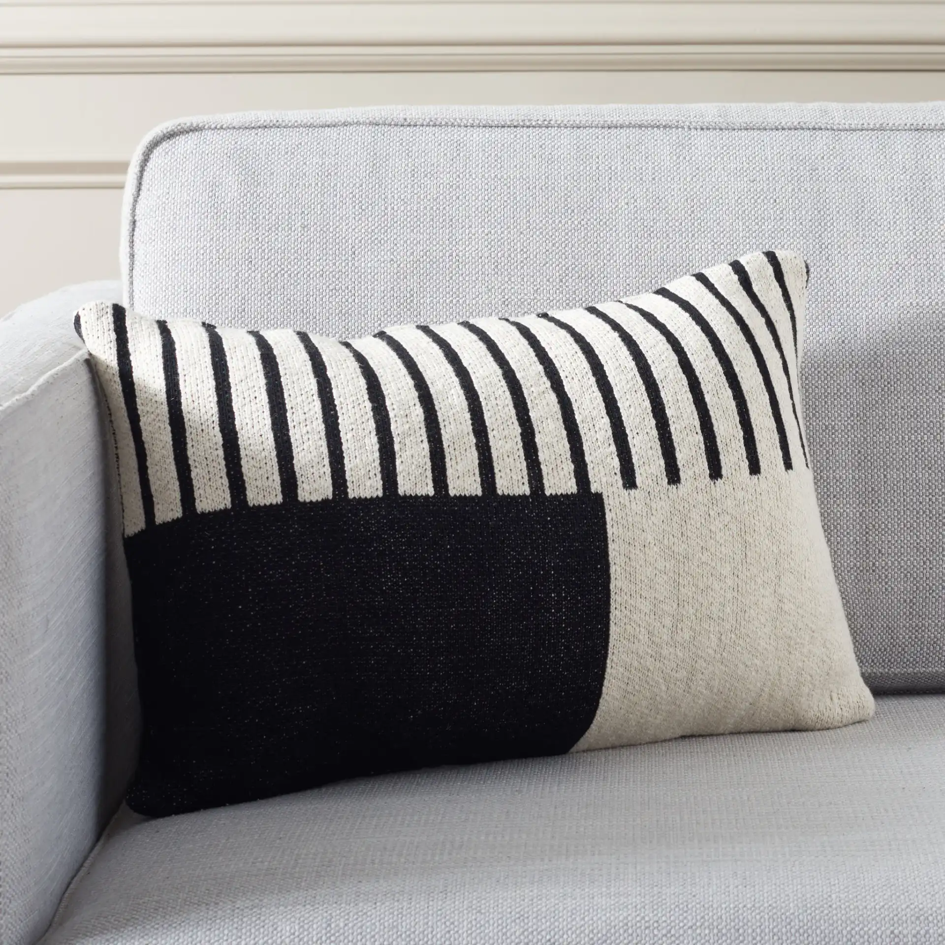 Drew Lumbar Pillow in Ivory / Black in a styled room