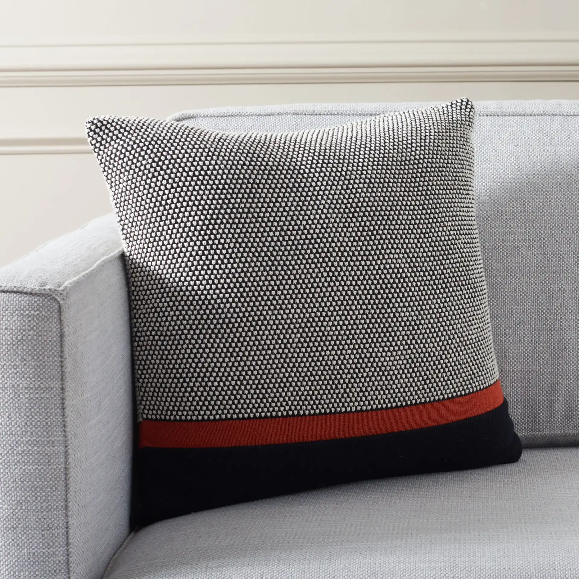 Pia 18X18 Pillow in Black / Red in a styled room