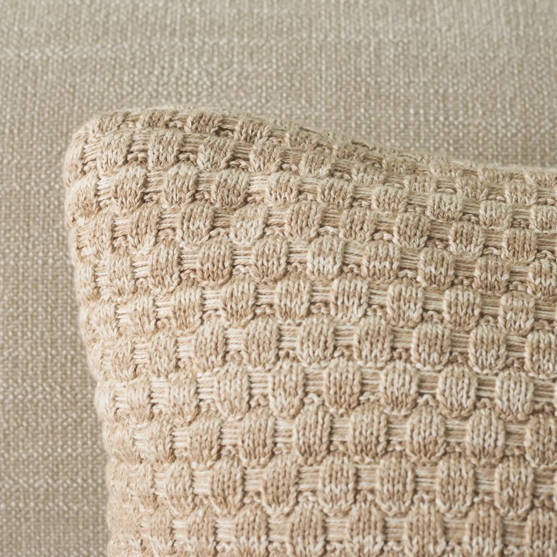 Rava Pillow in Natural / Beige in a styled room