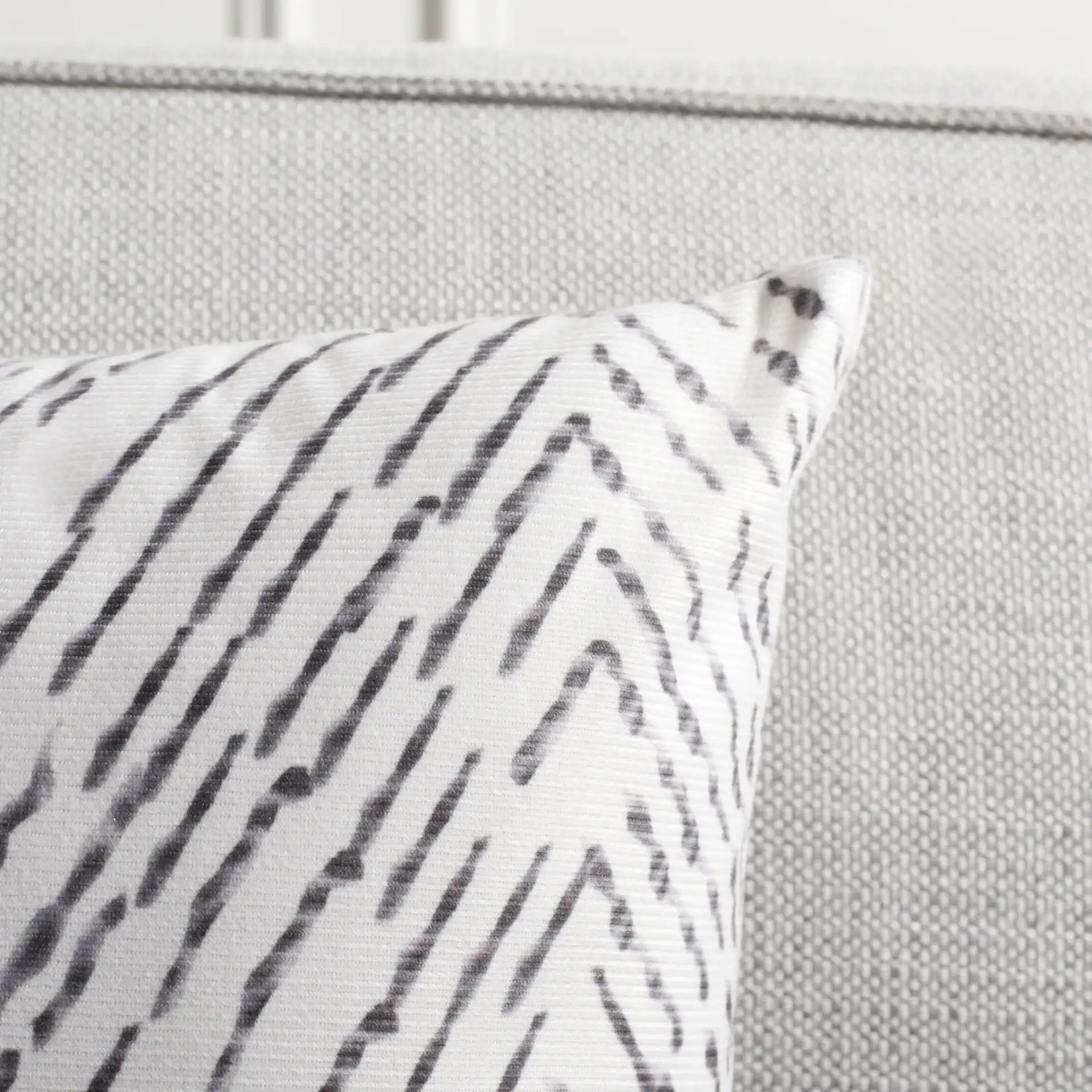 Zecora Pillow in Ivory / Black in a styled room