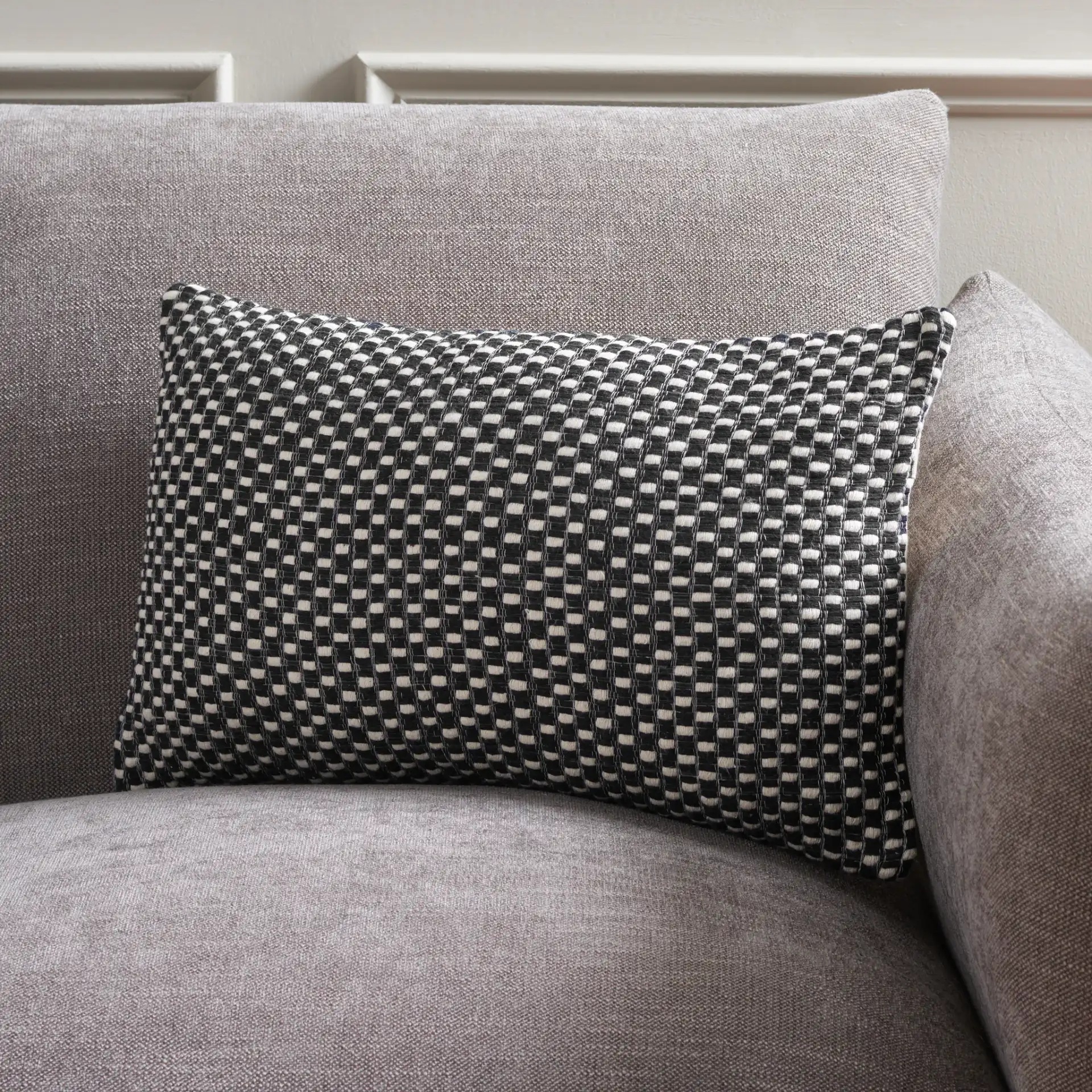 Millie Pillow in Black / Cream in a styled room