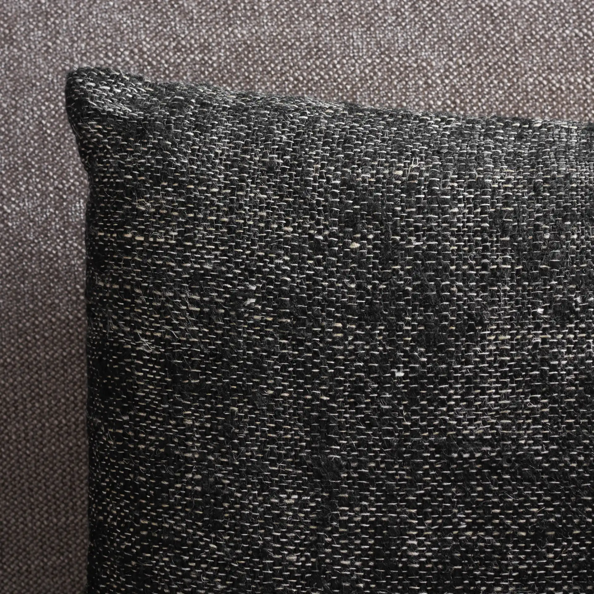 Rowe Pillow in Black / Natural in a styled room