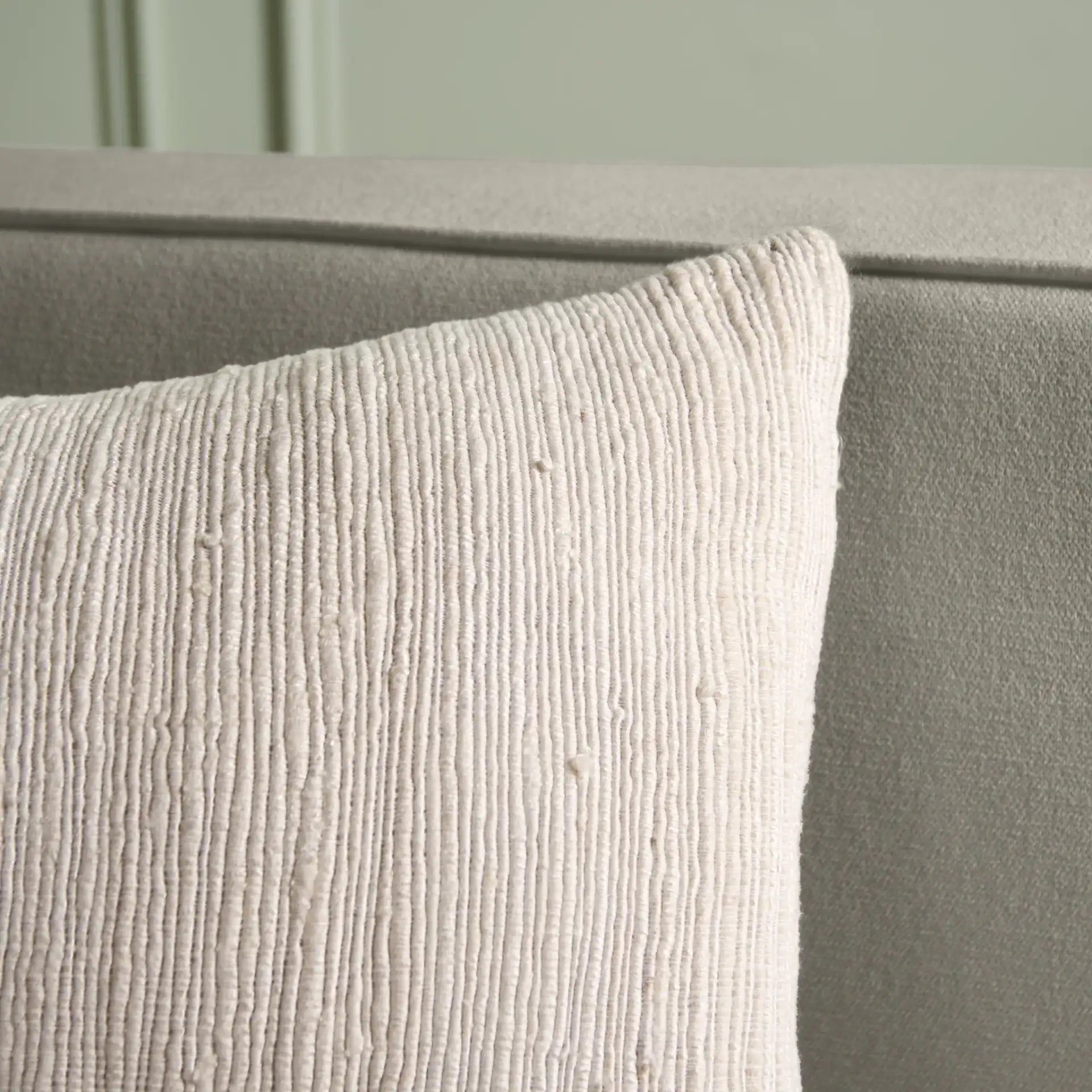 Ameya Pillow in Ivory / Natural in a styled room