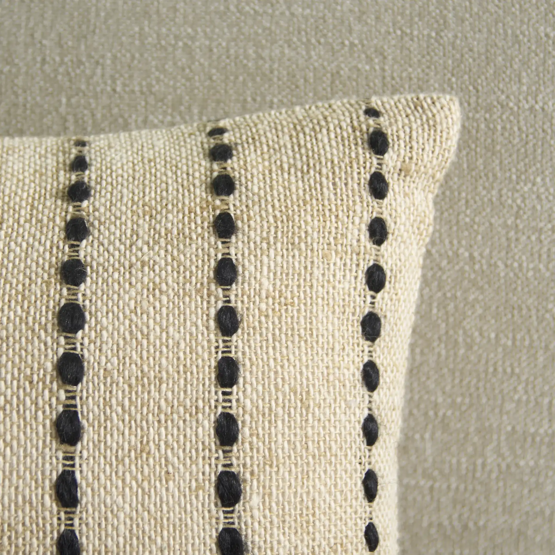 Joi Pillow in Natural / Black in a styled room