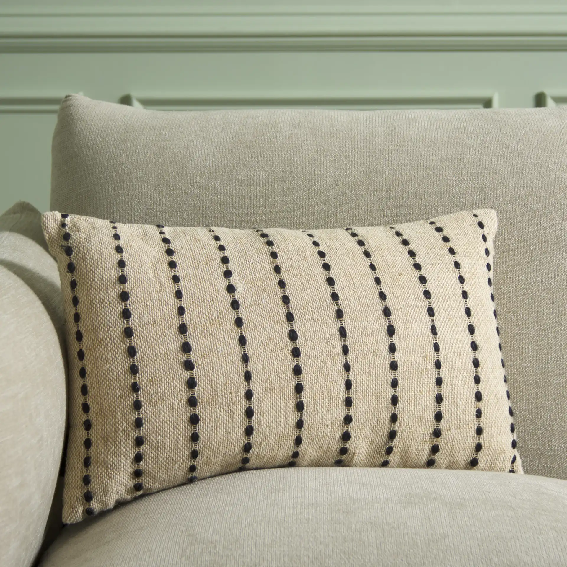 Joi Pillow in Natural / Black in a styled room